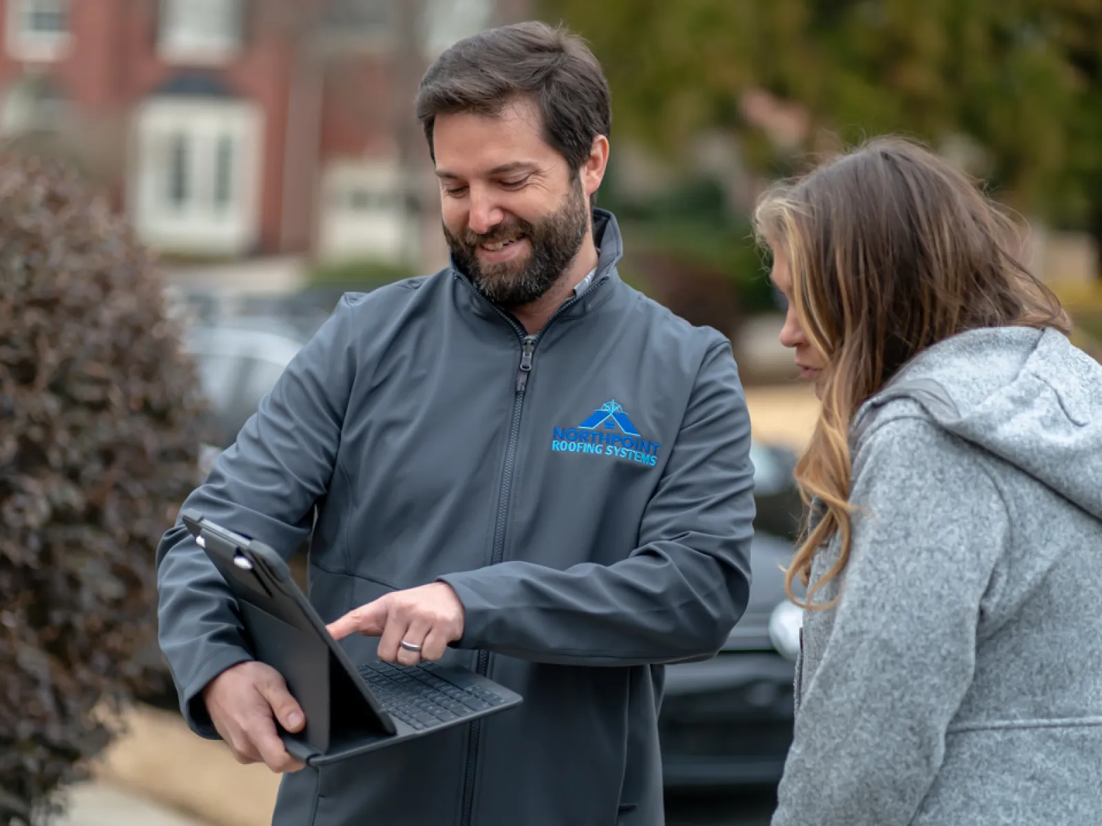 Northpoint Roofing technician talking with a client