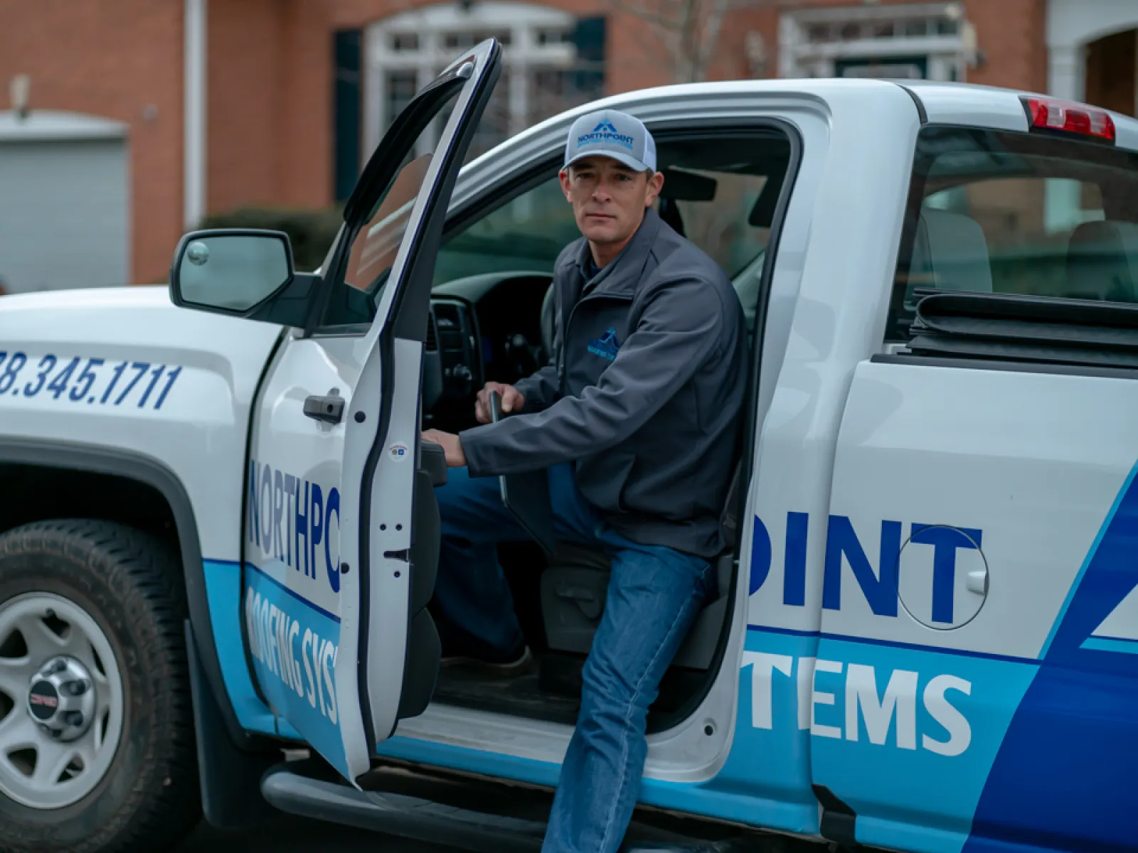 Northpoint Roofing Systems gutter installer in a truck