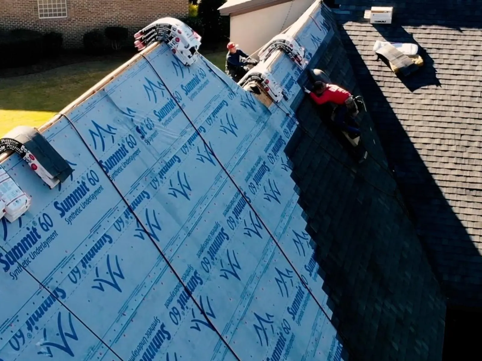 a group of people working on a roof