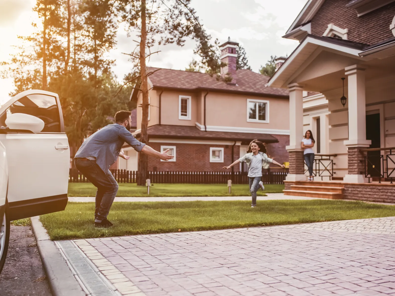 a person and a child playing in a yard