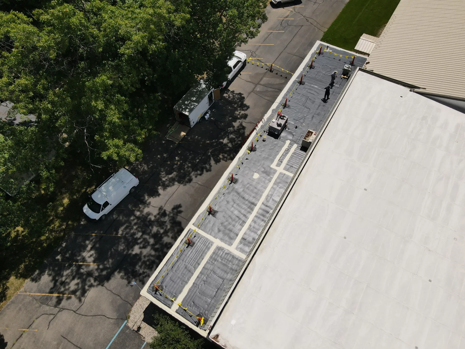 an aerial view of a roof and a street