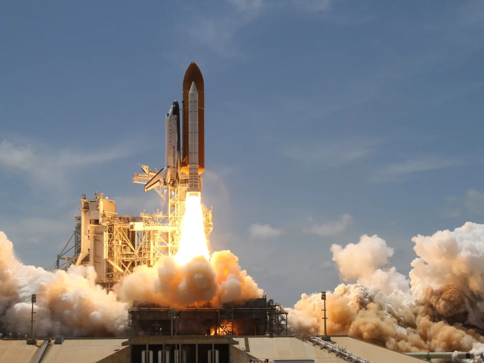 a rocket taking off from a launchpad