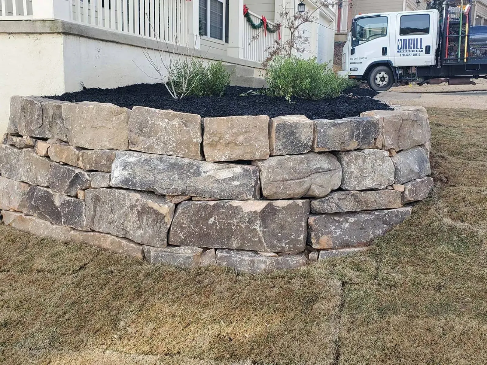 a pile of rocks in front of a building