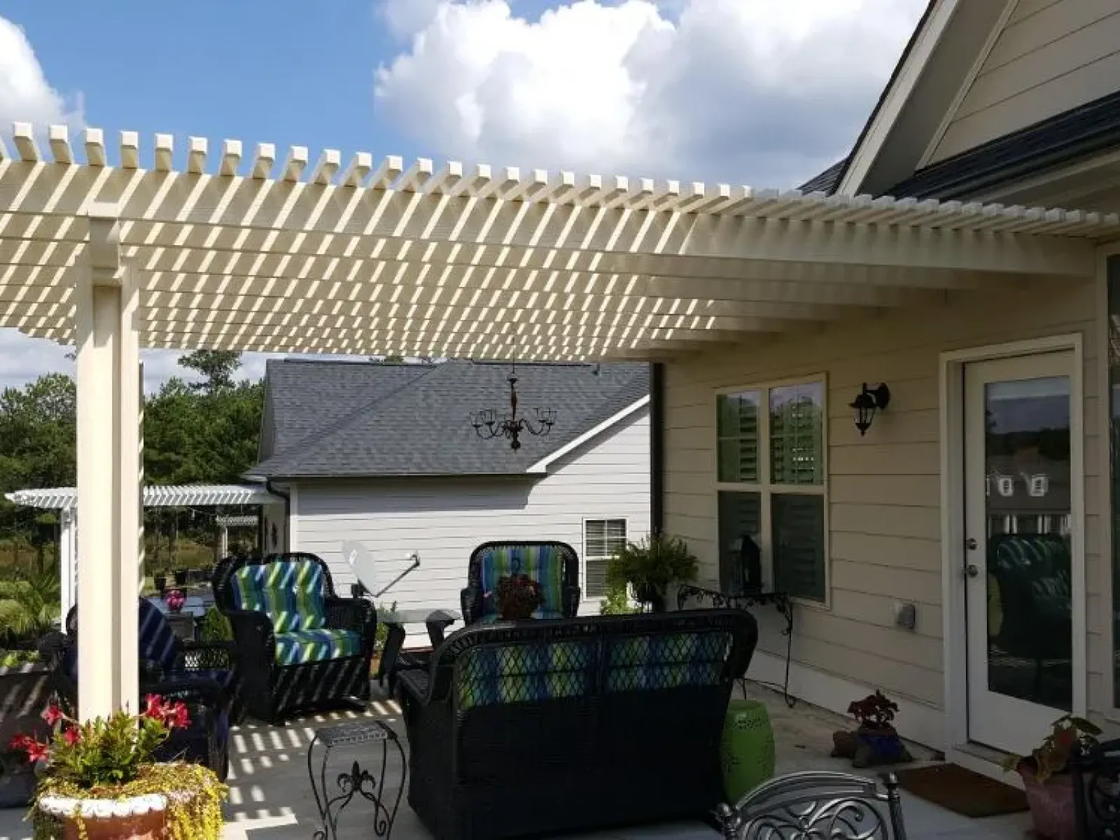 a pergola with a covered patio
