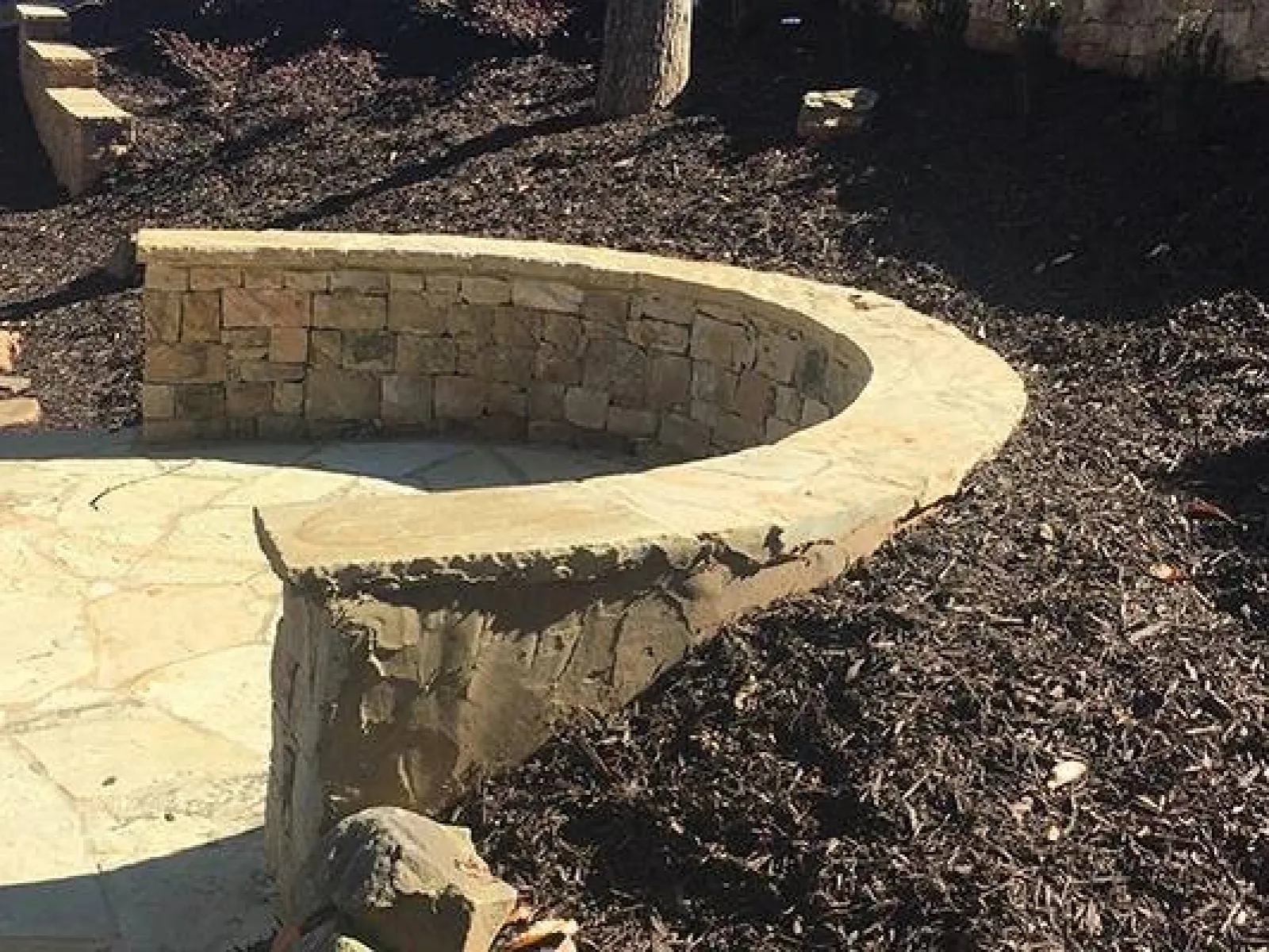 a stone structure with a stone wall