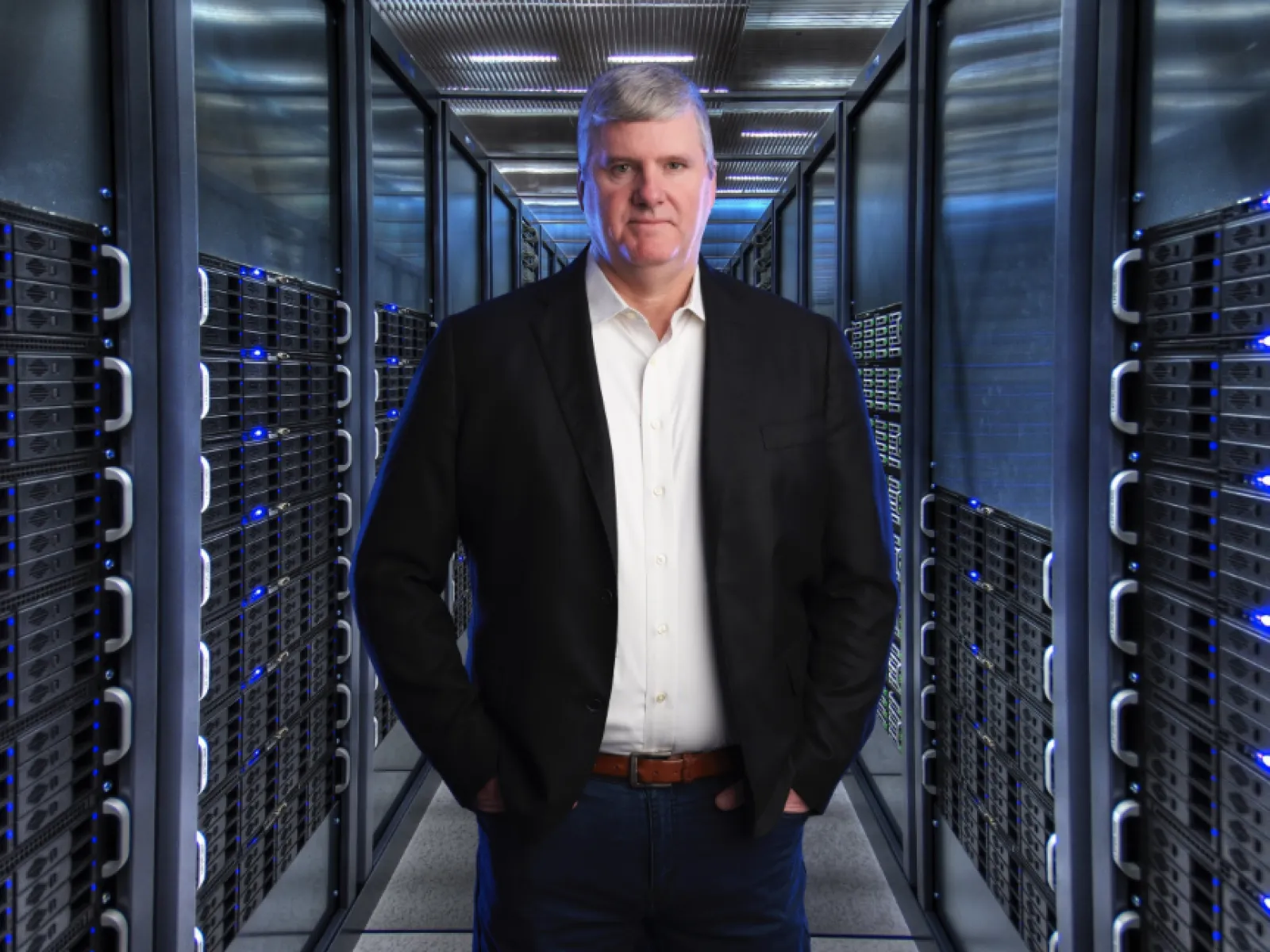 a man standing in a server room