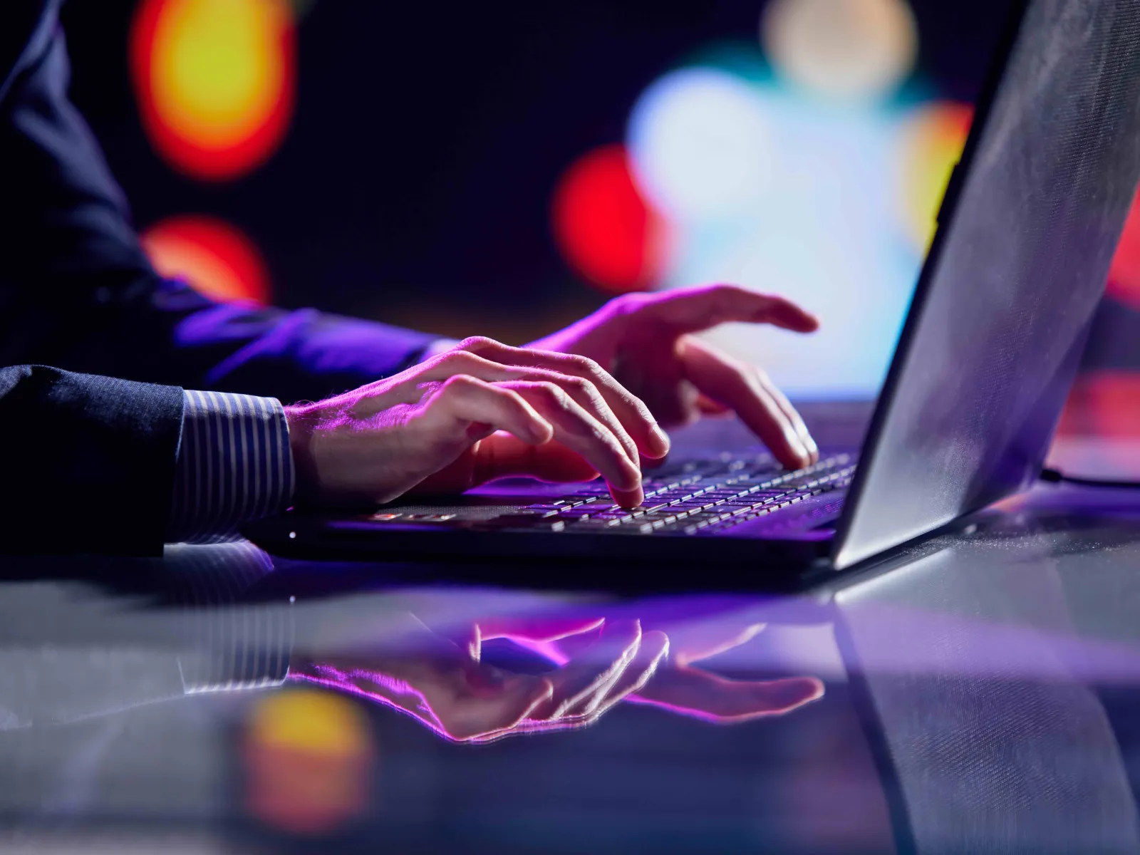 a person typing on a laptop