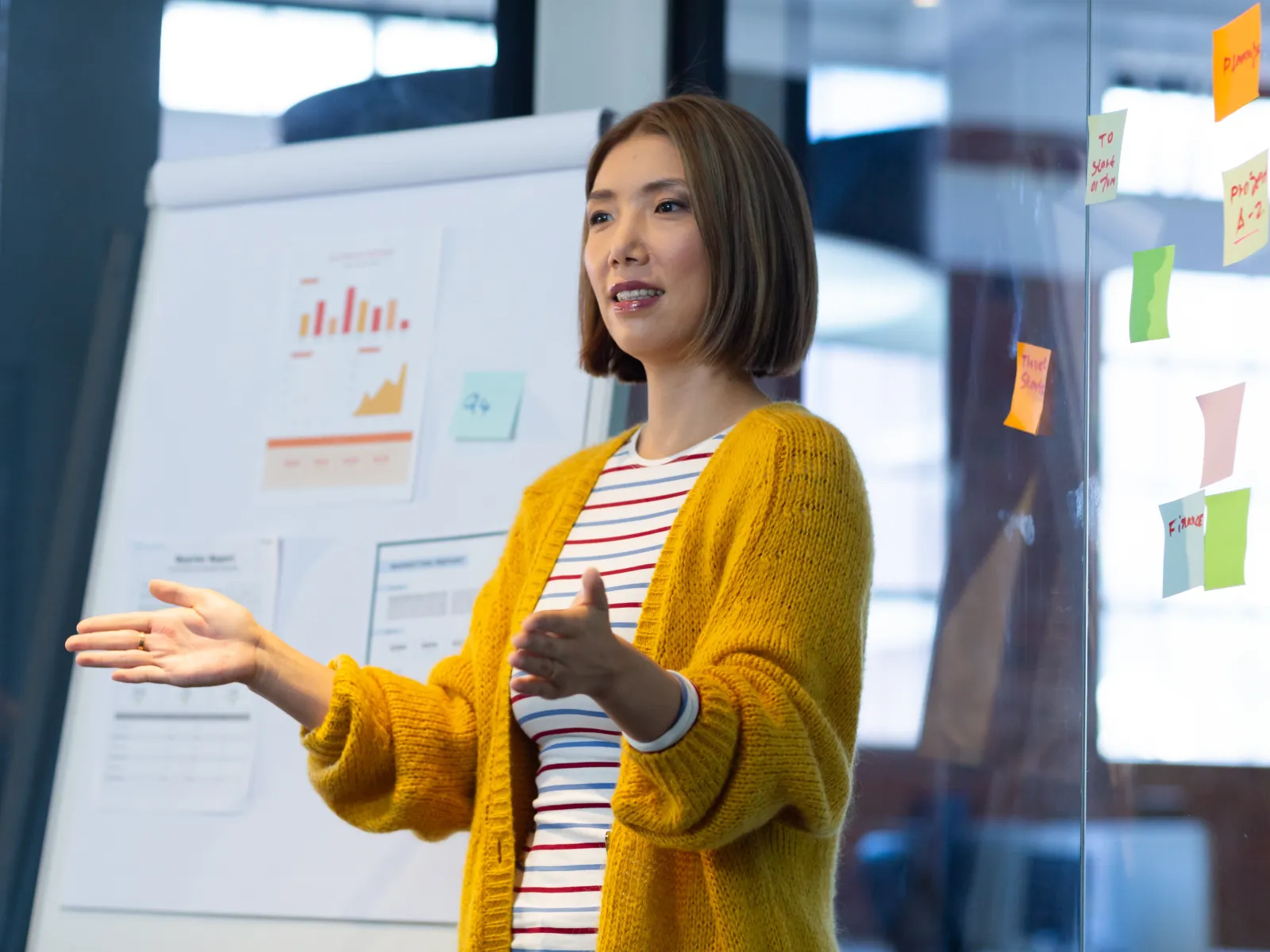 a person standing in front of a white board