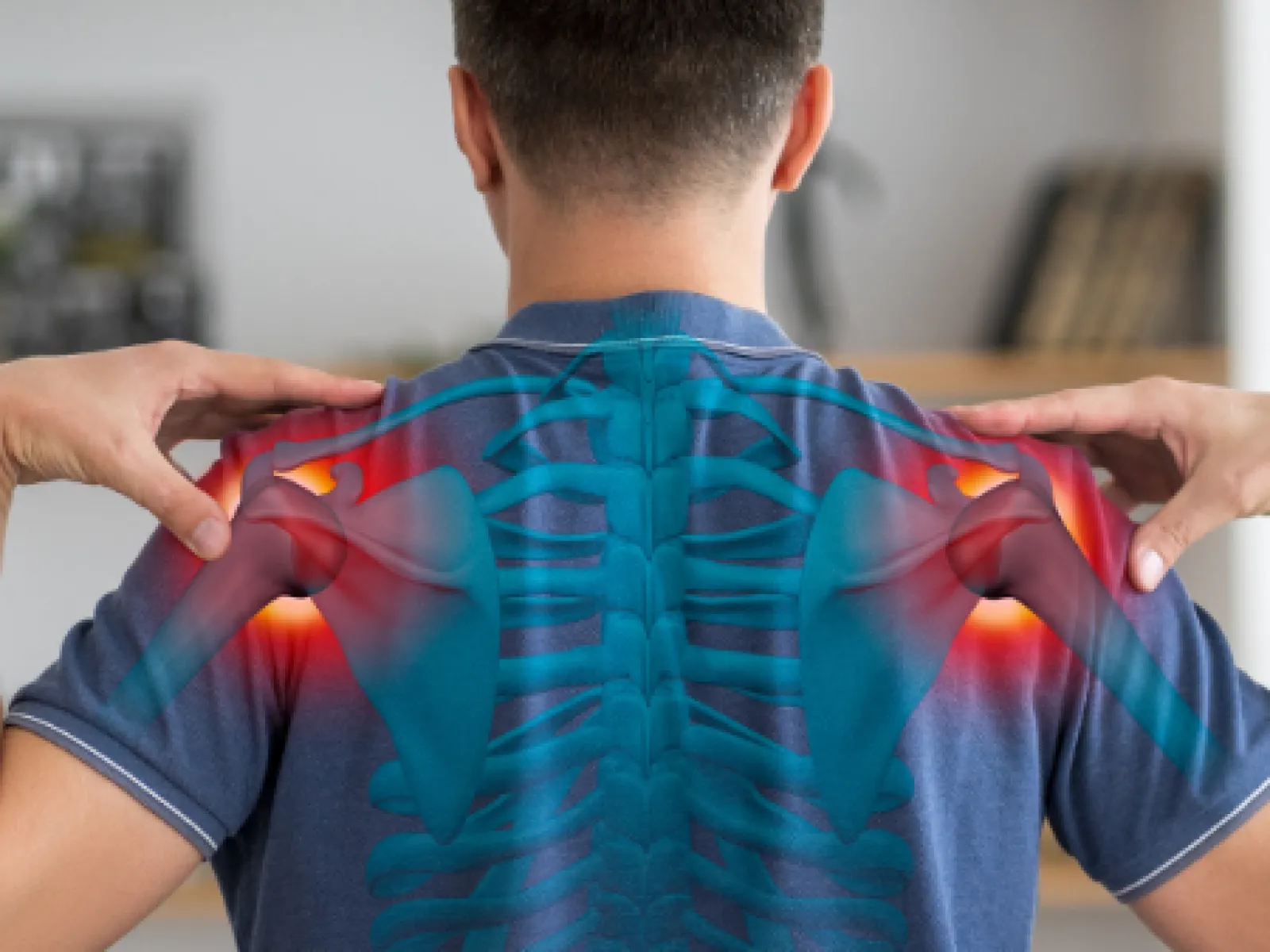 Man with shoulder pain highlighted on his back with digital overlay of spine and shoulder bones in red.