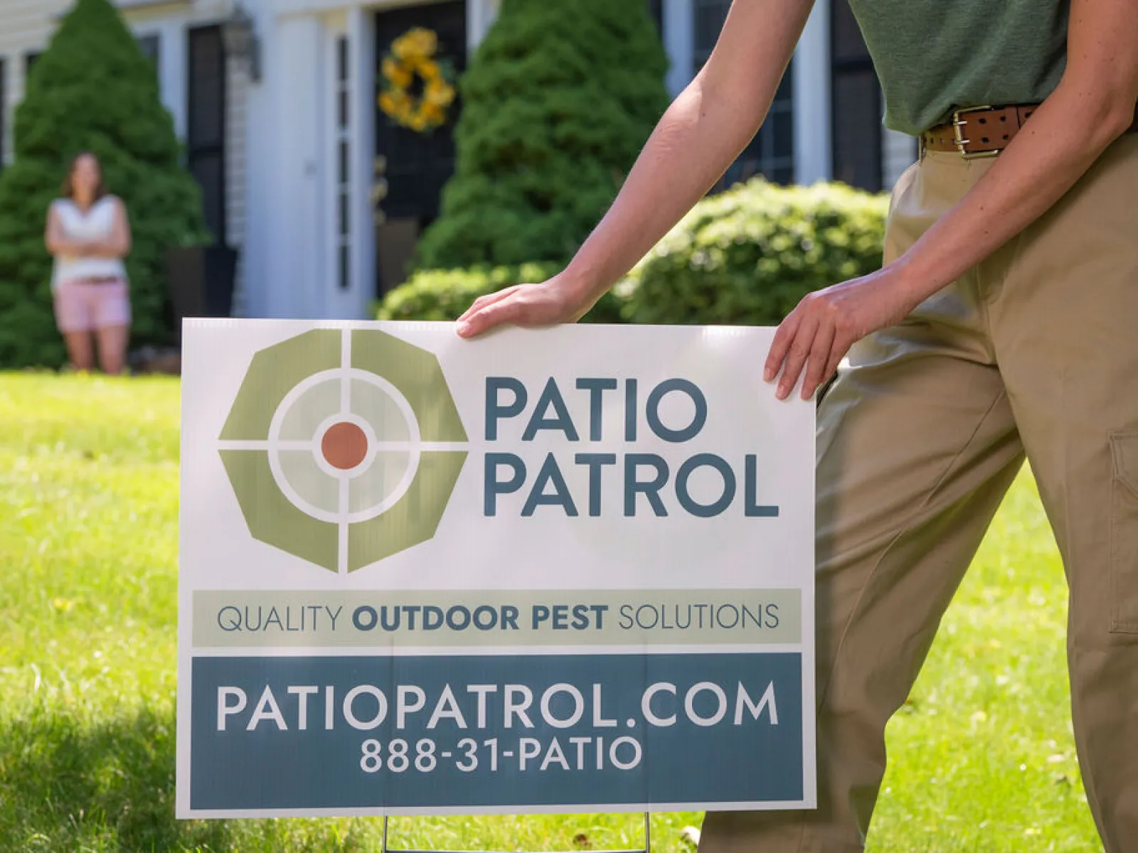 tech installing a yard sign