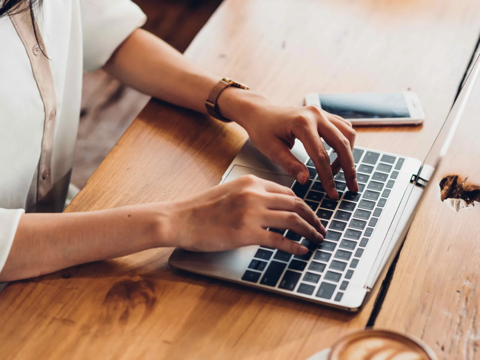 a person typing on a laptop