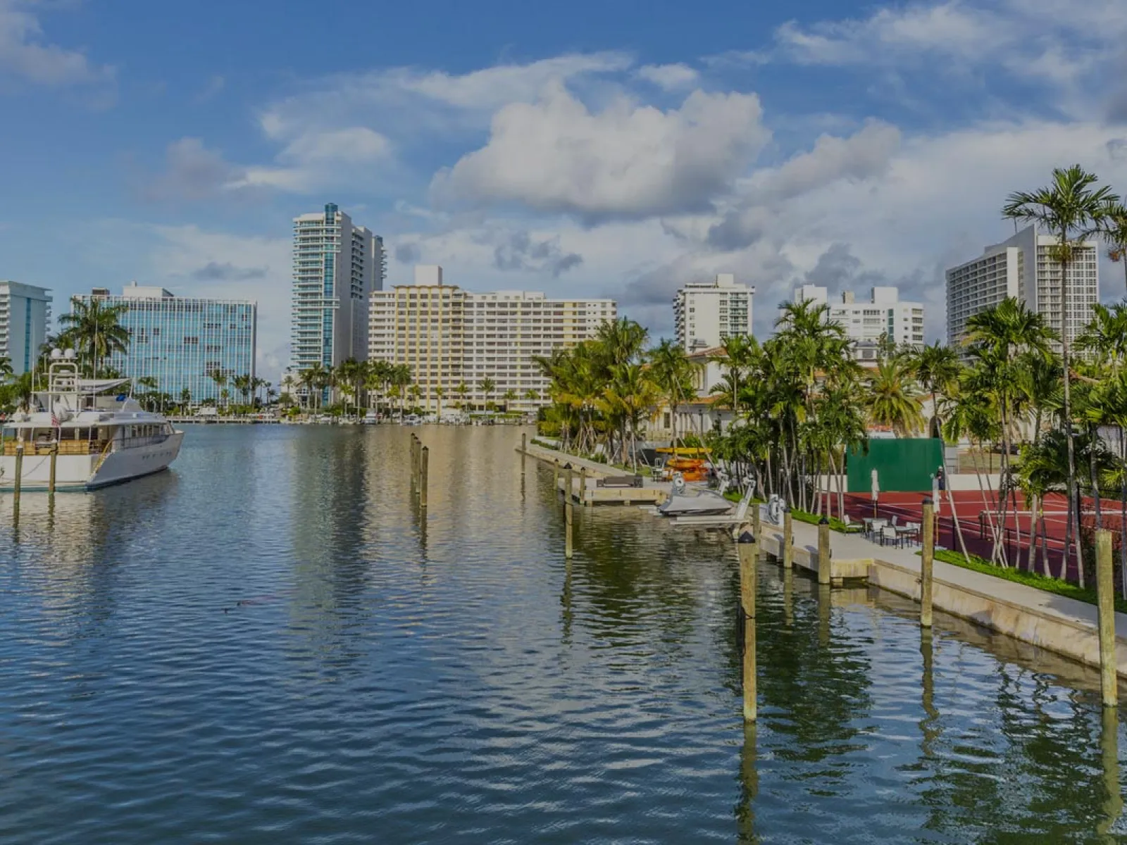 a body of water with boats and buildings around it