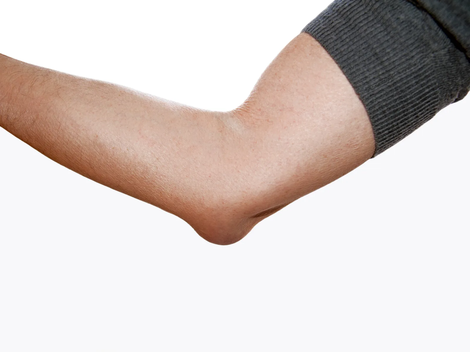 Close-up of a human arm bent at the elbow wearing a dark sleeve against a white background