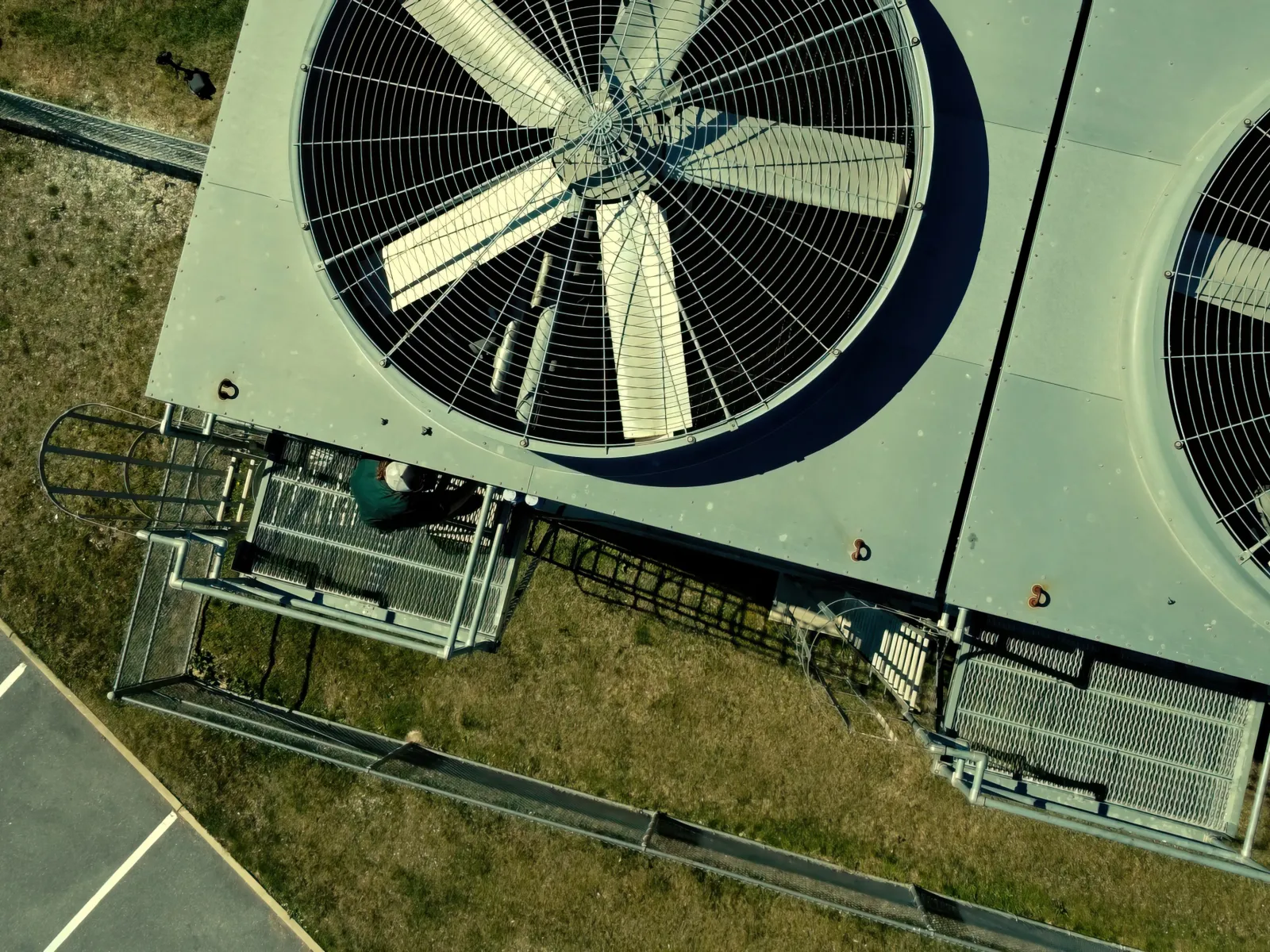 a person standing next to a large metal object