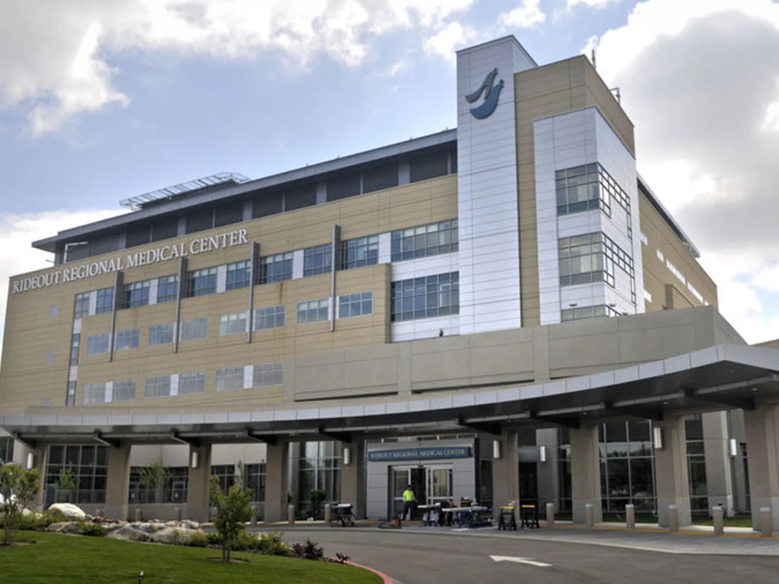 Exterior view of Rideout Regional Medical Center building with modern architecture and cloudy sky.