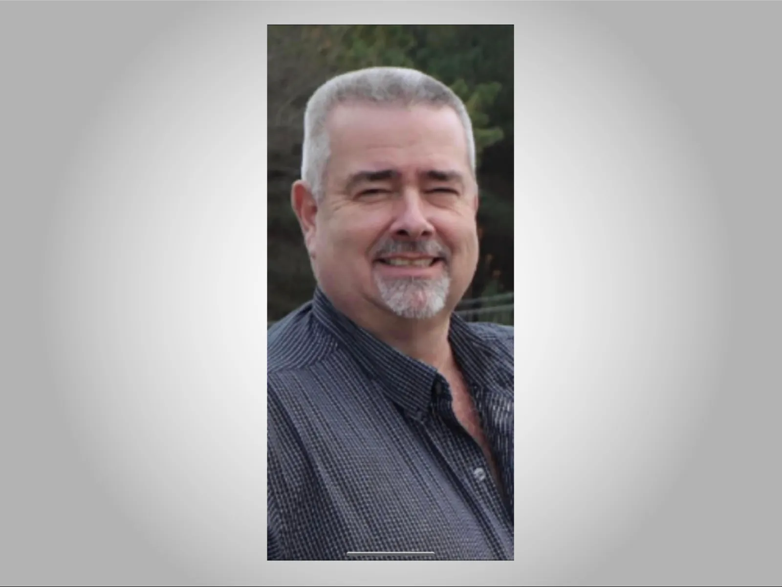 a man smiling for the camera