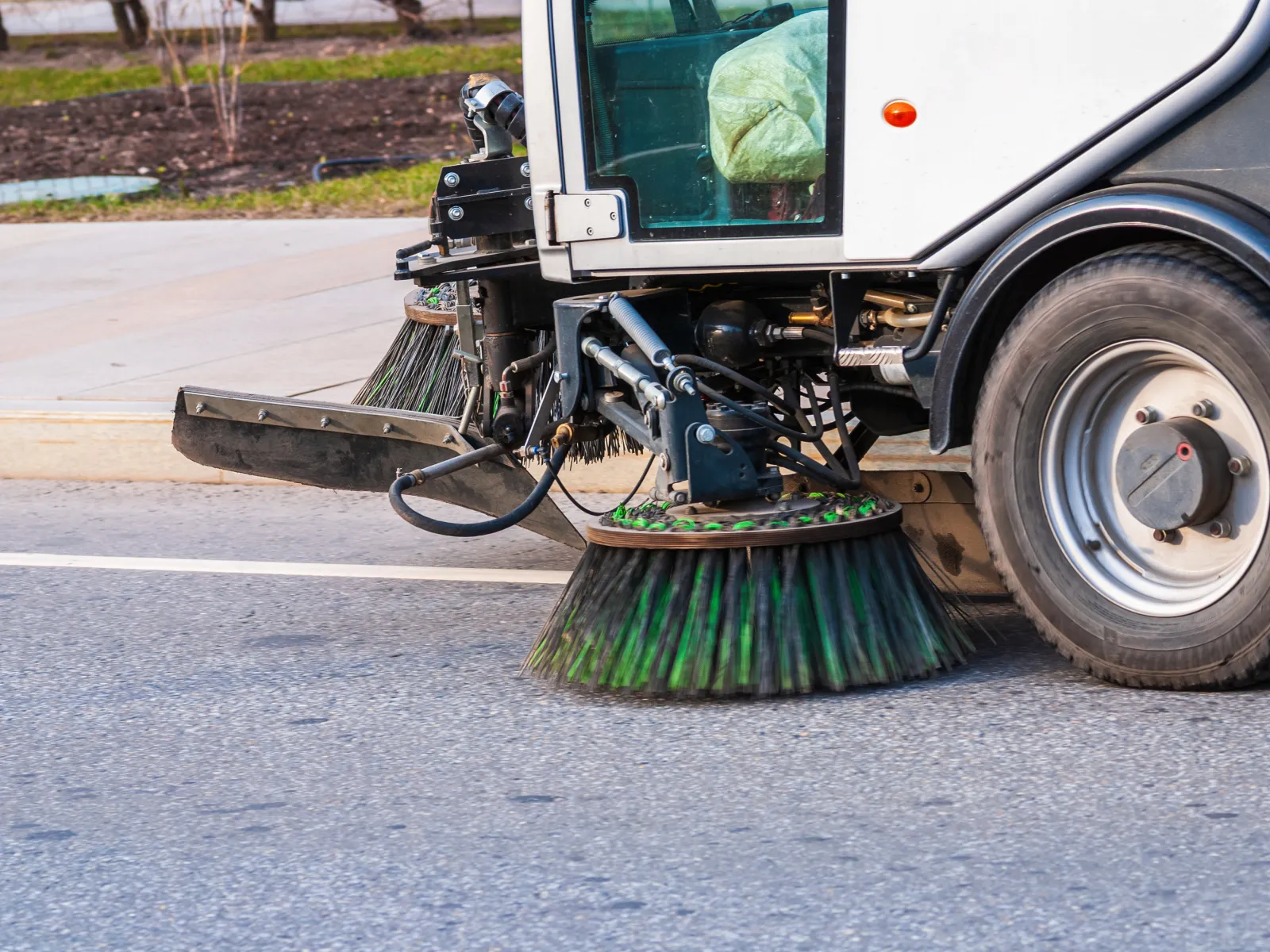 a vehicle with a large metal object on the front