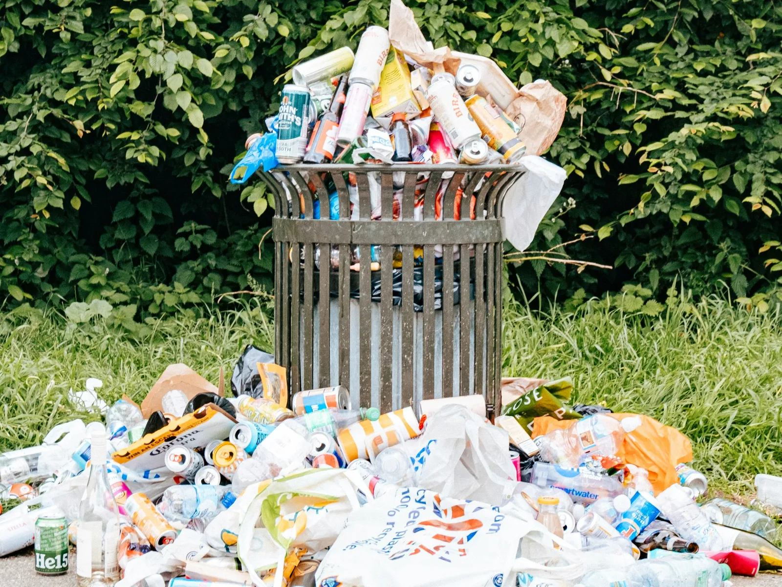 a garbage bin full of trash