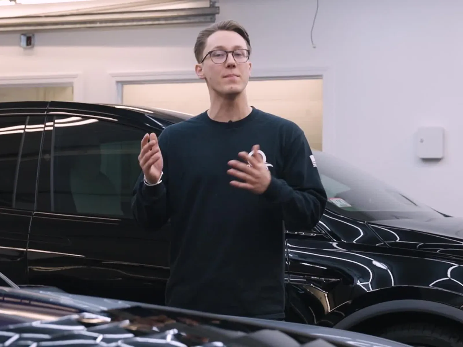 a person standing next to a car
