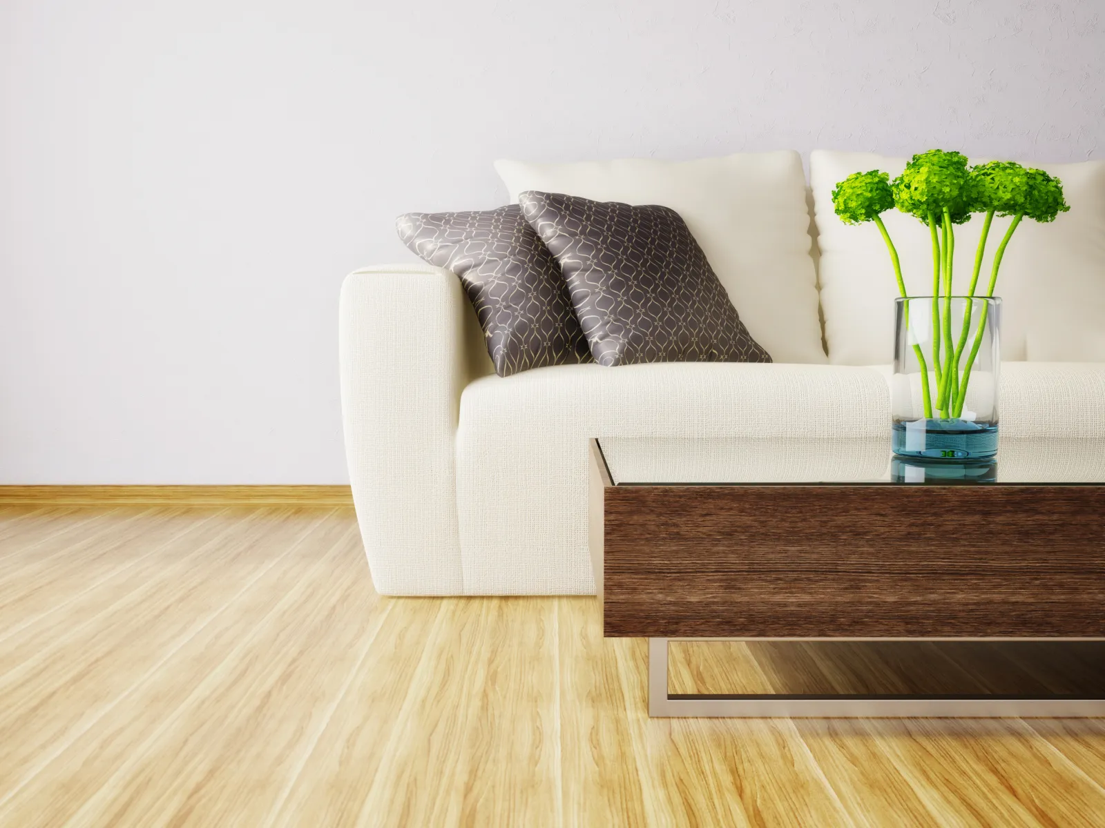 Modern white sofa with patterned pillows and a wooden coffee table with green flowers in a glass vase