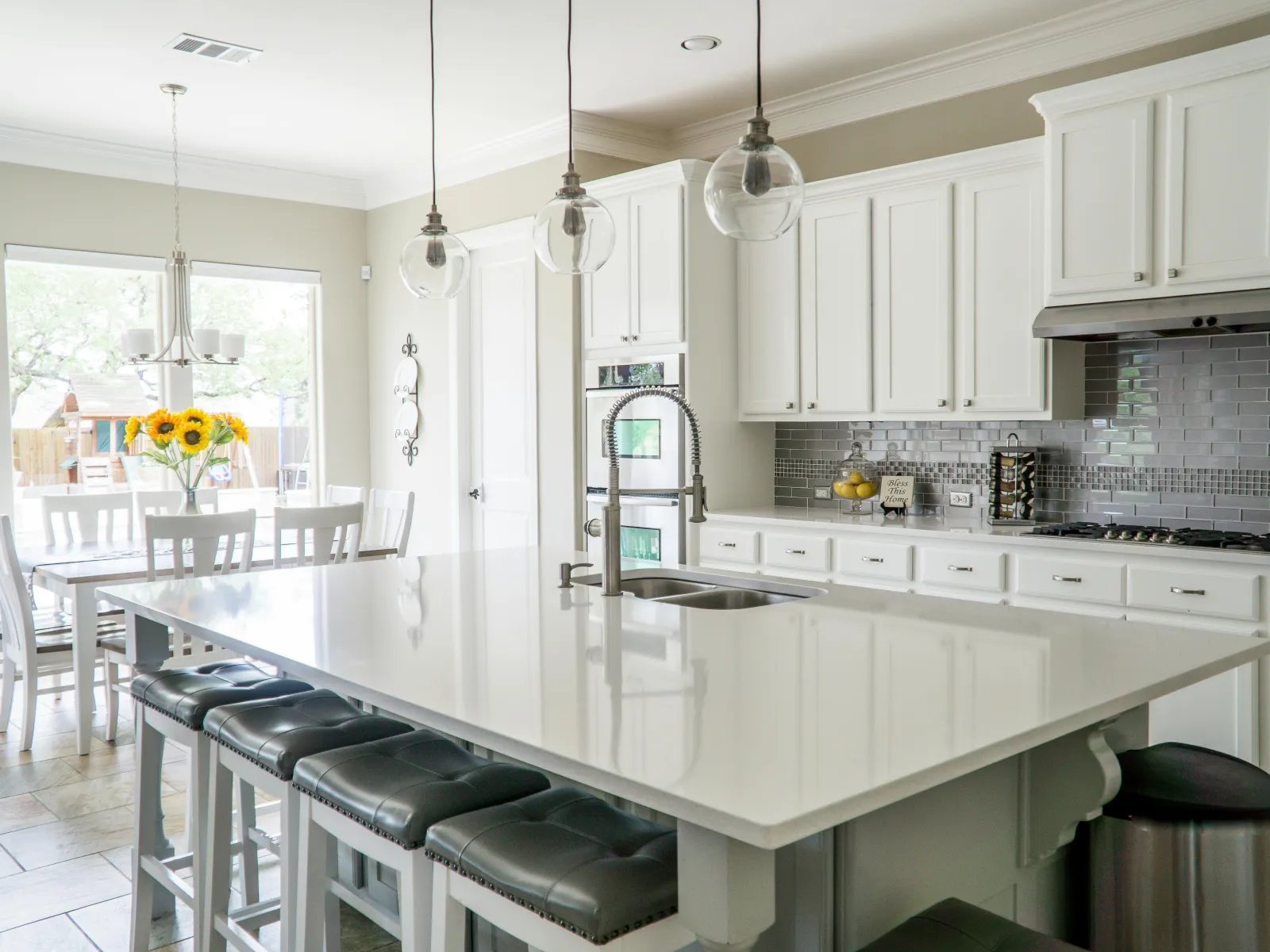 a kitchen with white cabinets
