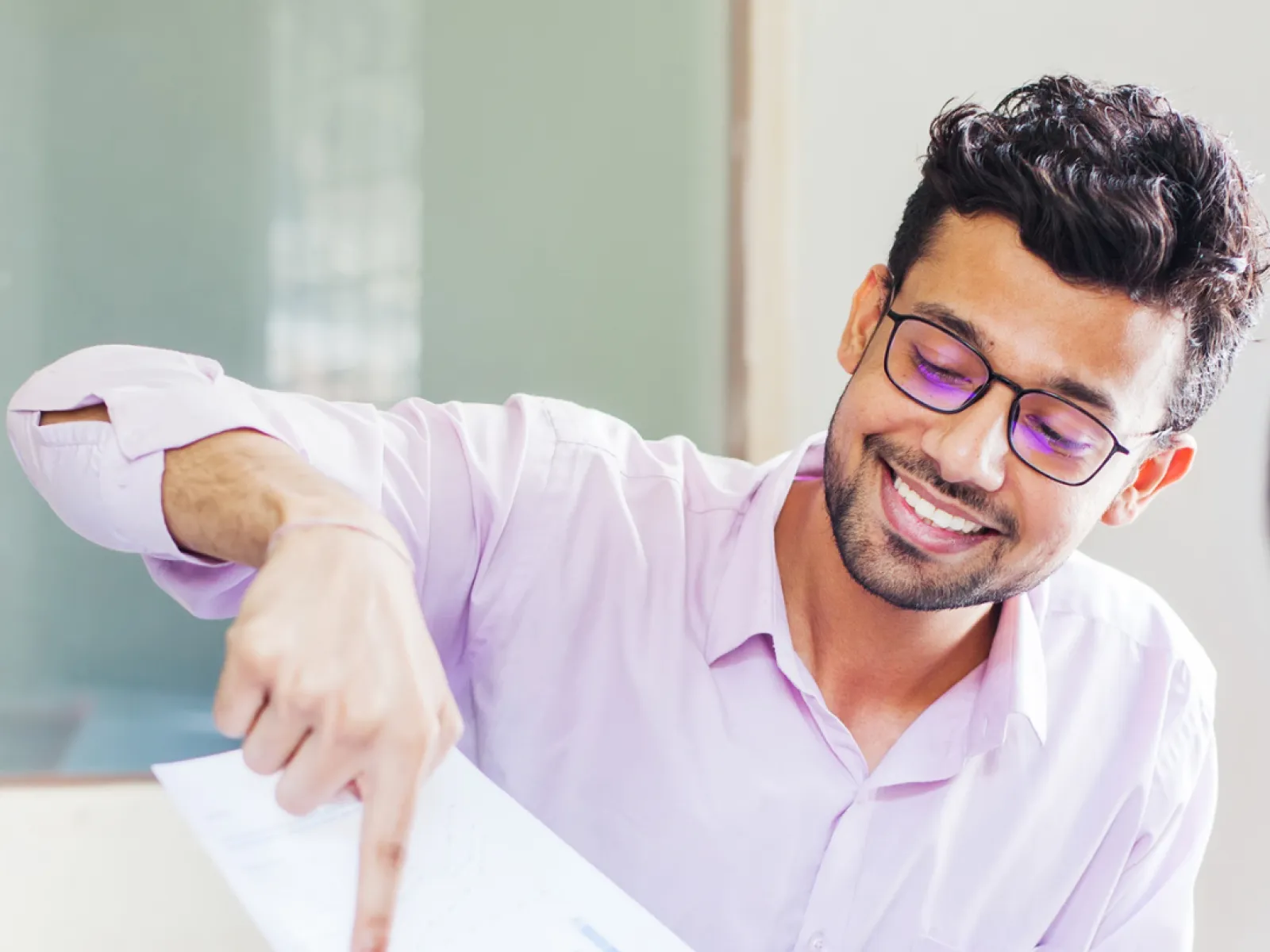 a man holding a piece of paper