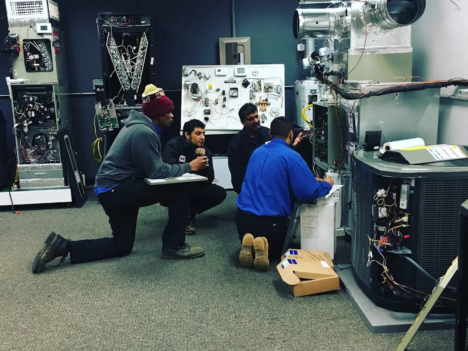Group of technicians working on HVAC systems