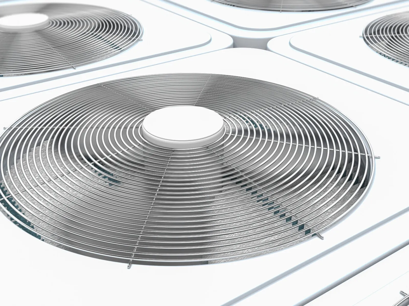 Close-up of modern outdoor air conditioning unit fans with metal protective grilles in a row.