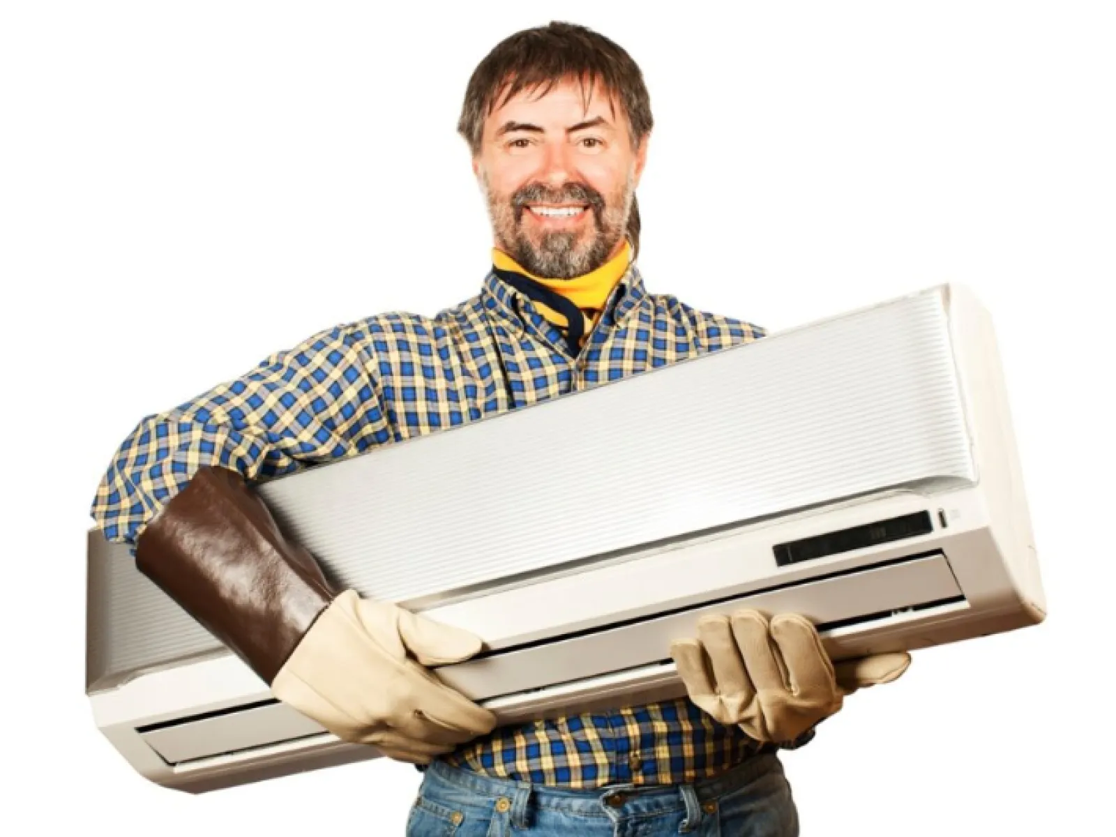 Smiling man in plaid shirt holding a large air conditioning unit against a white background
