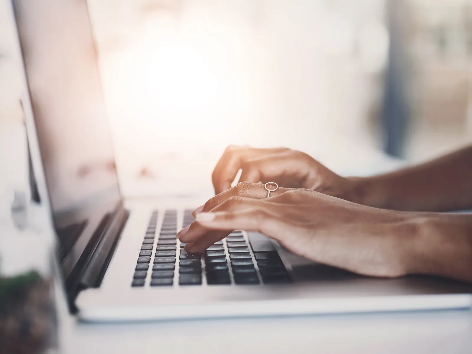 a person typing on a laptop