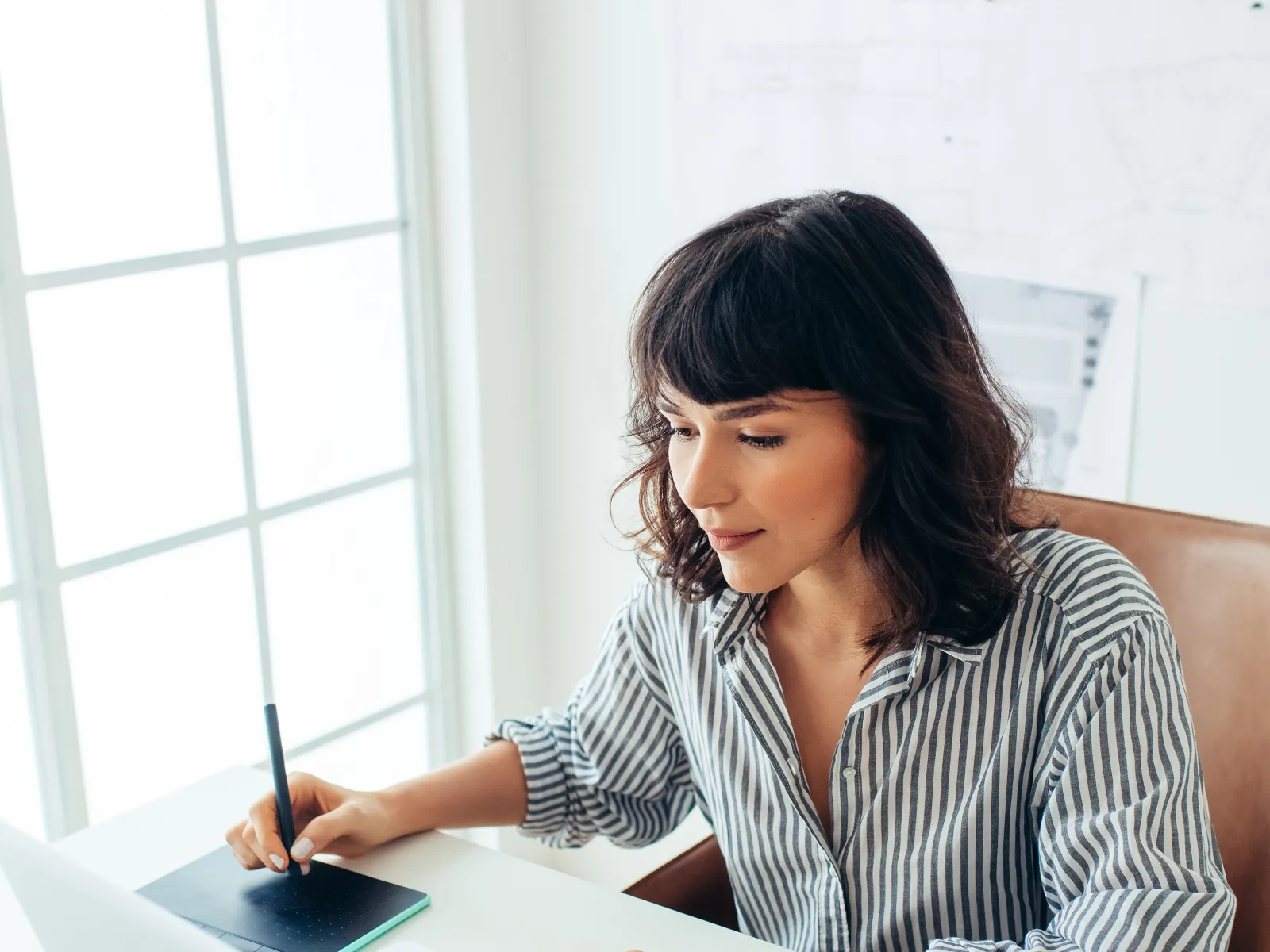 a woman working on her laptop