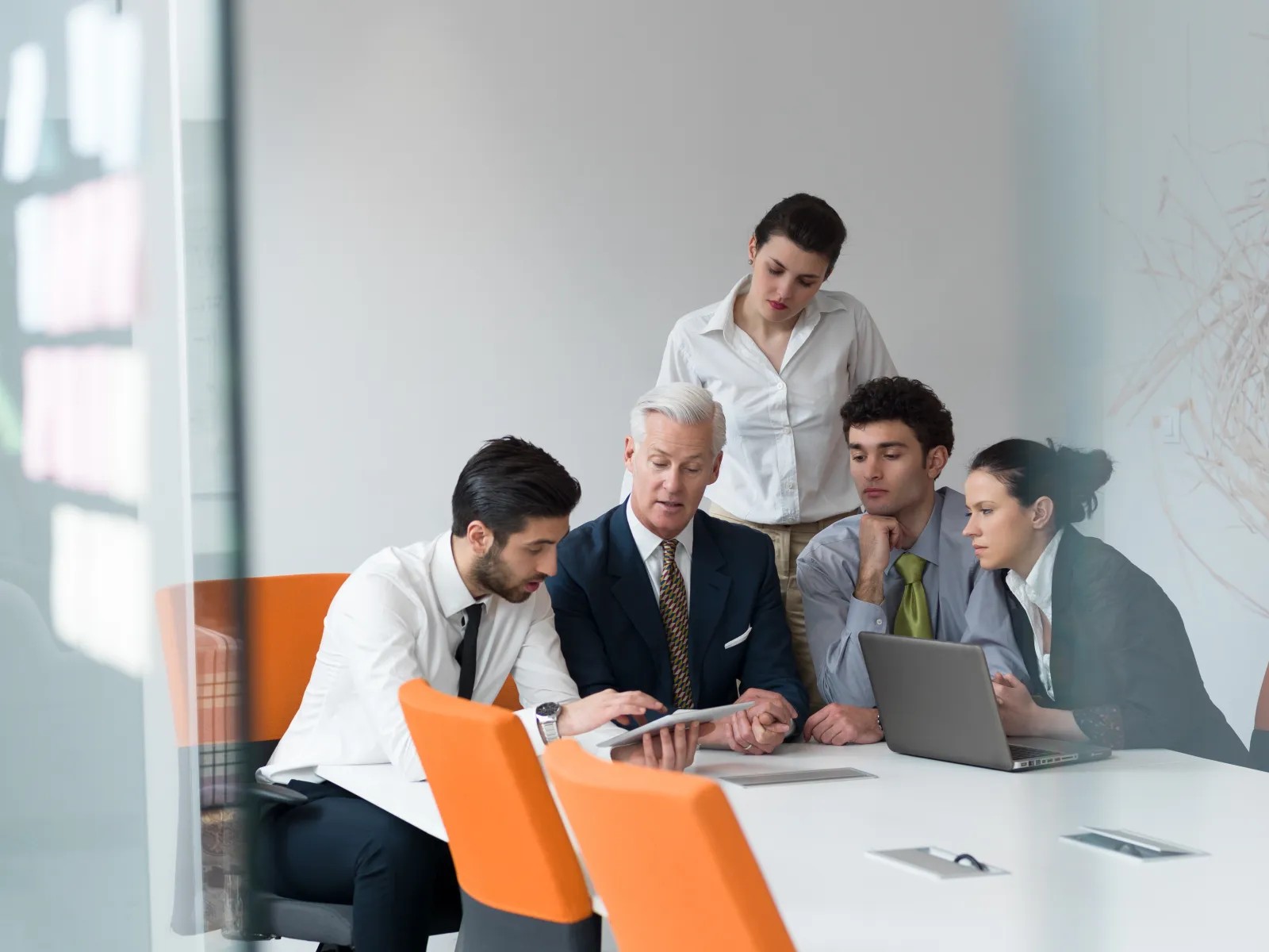 a group of men sitting around a table