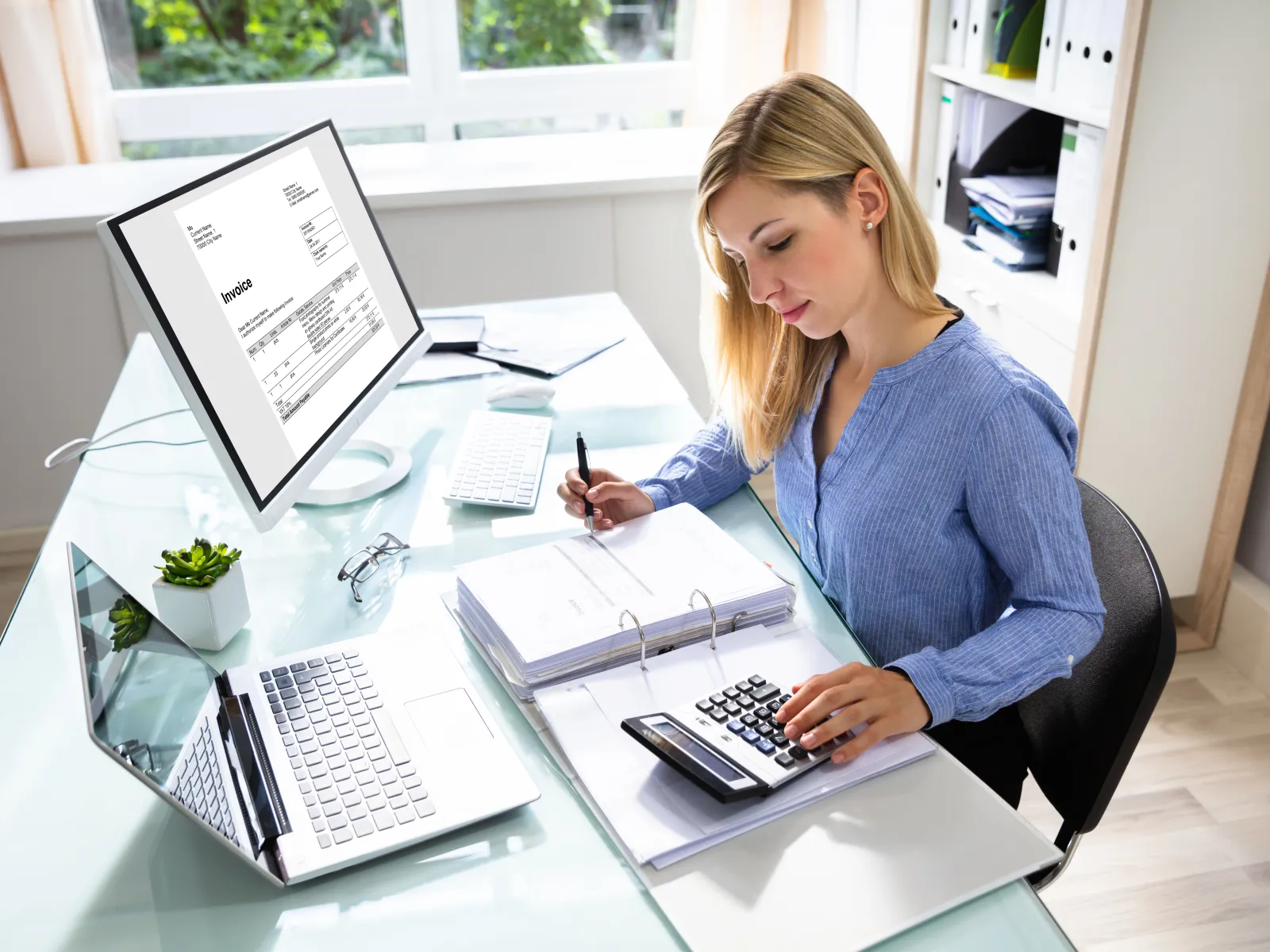 a woman working on her computer
