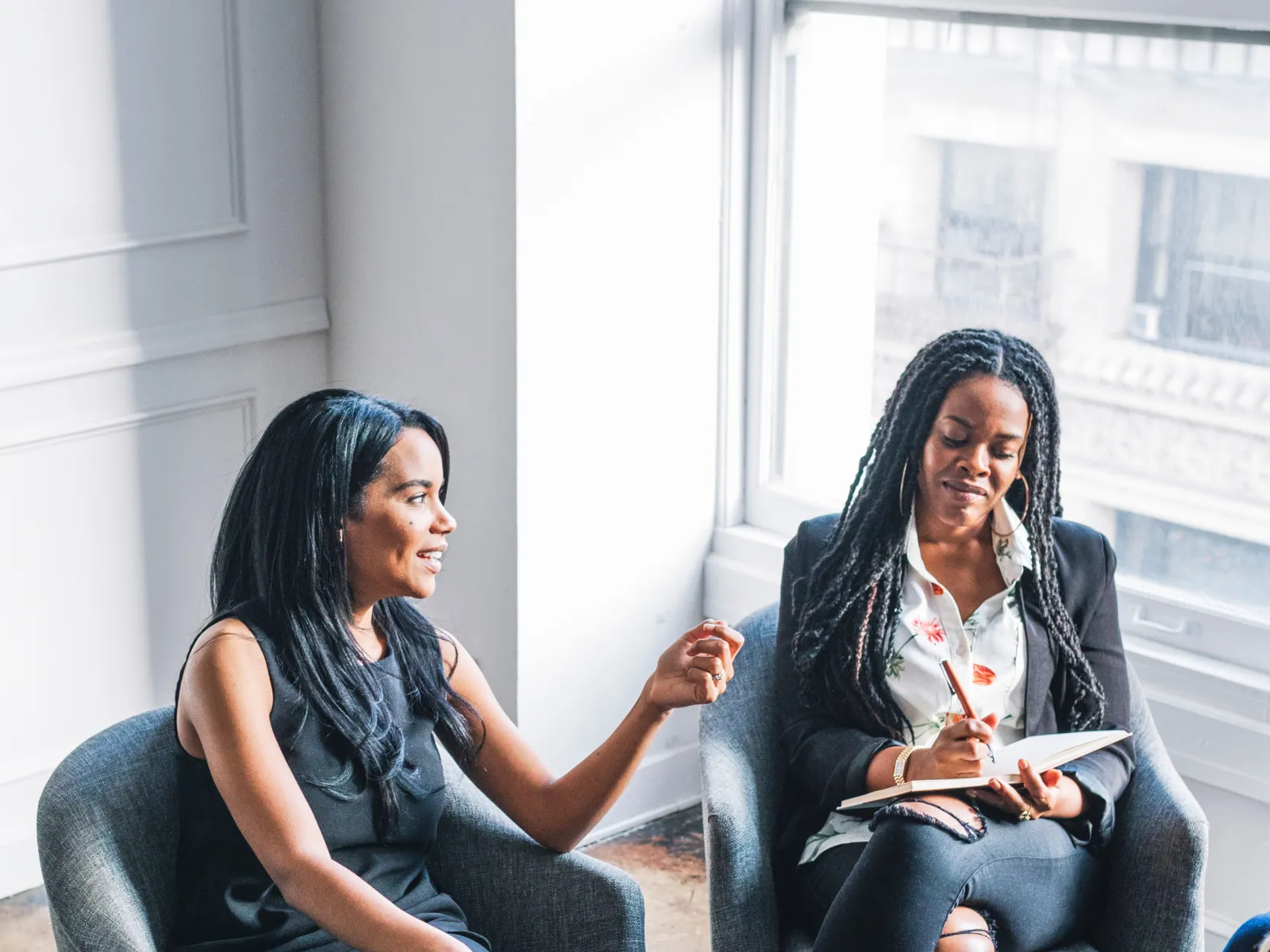 a few women sitting in chairs