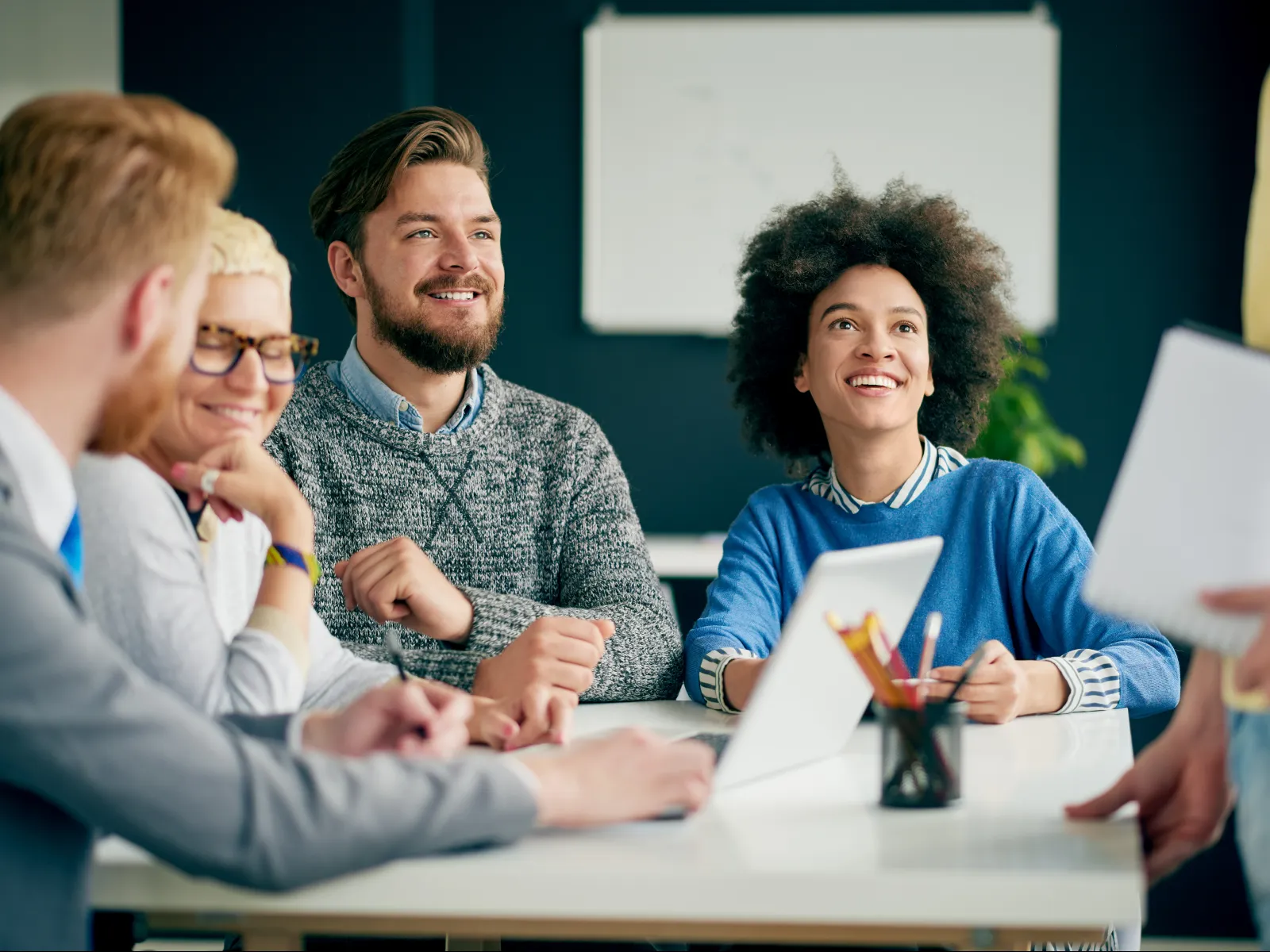 a group of people sitting at a table