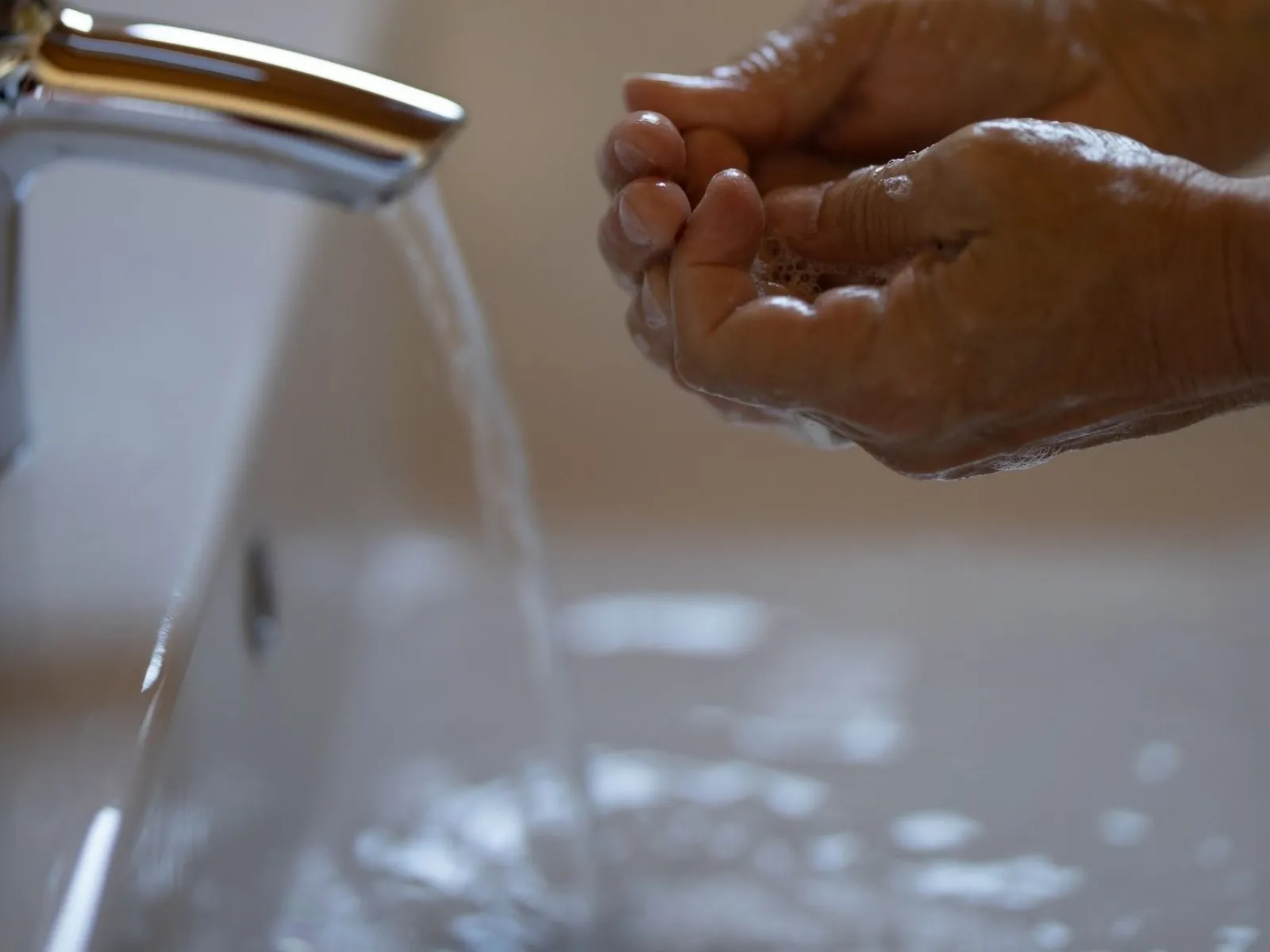 a rooterplus technician checking hot water