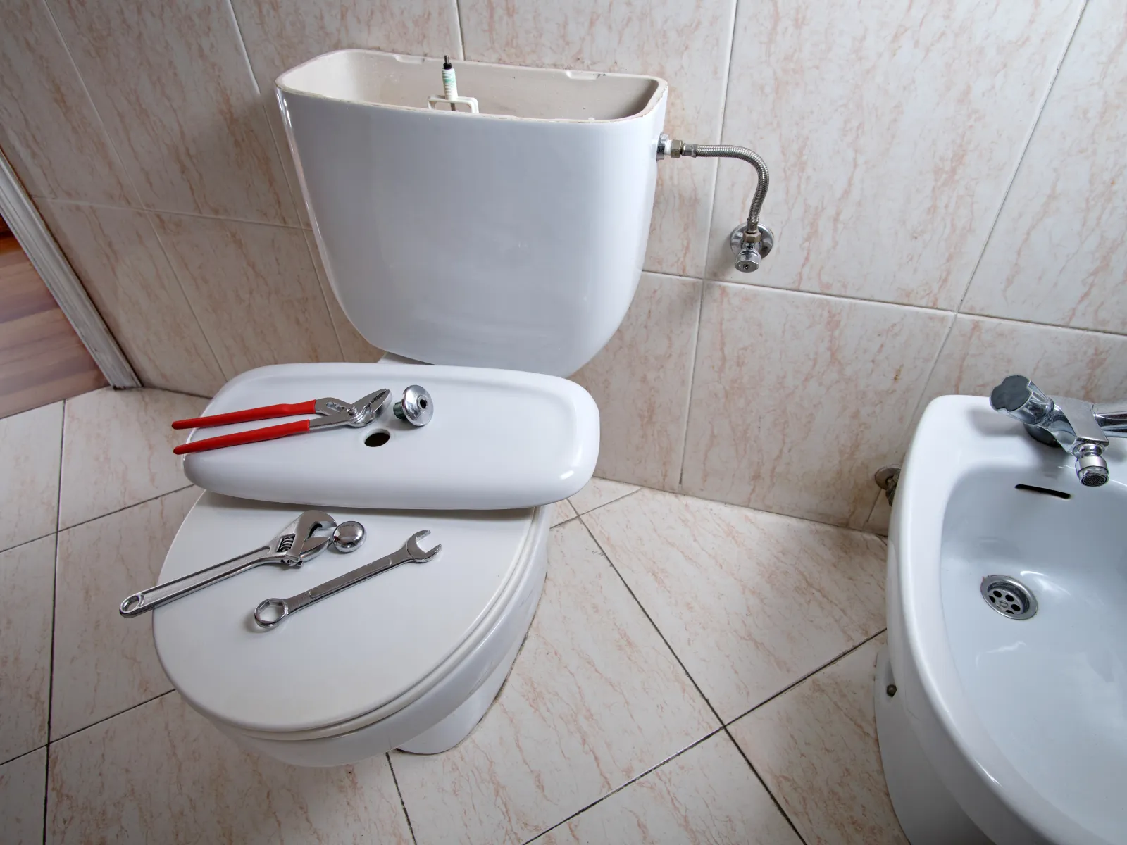 a toilet being repaired in cumming