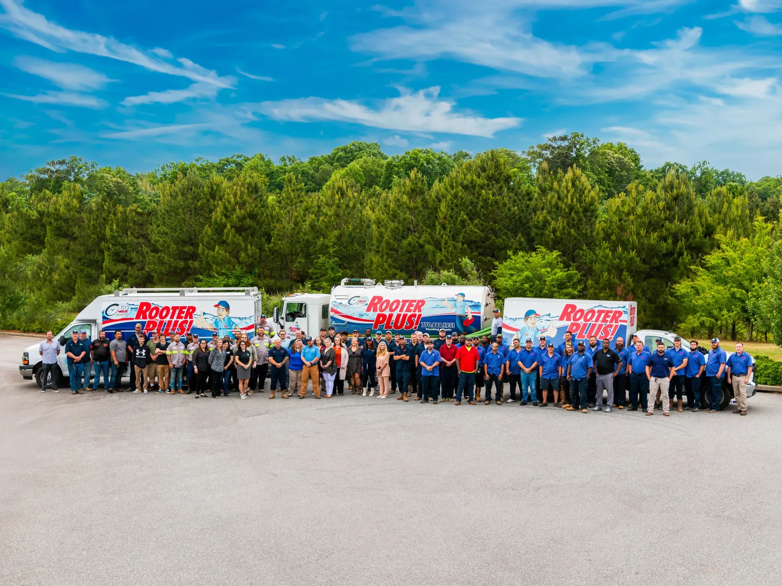 a group of people standing in front of a line of food trucks