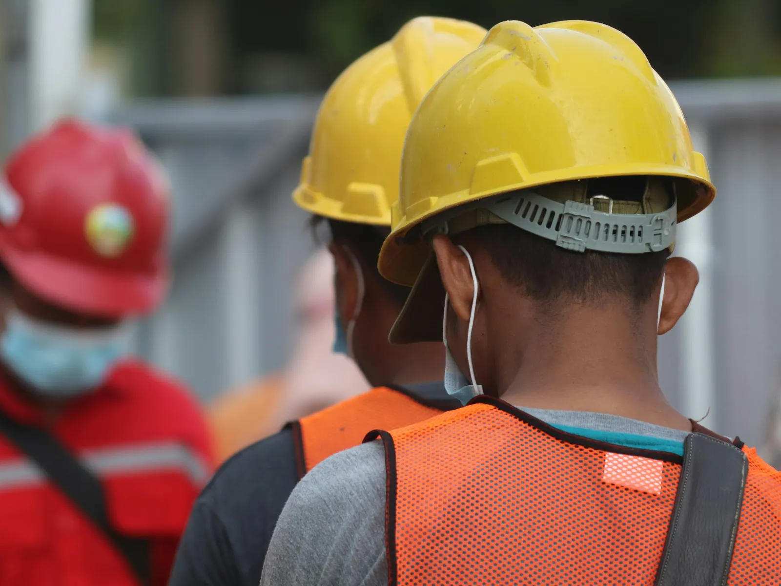 a person wearing a yellow helmet