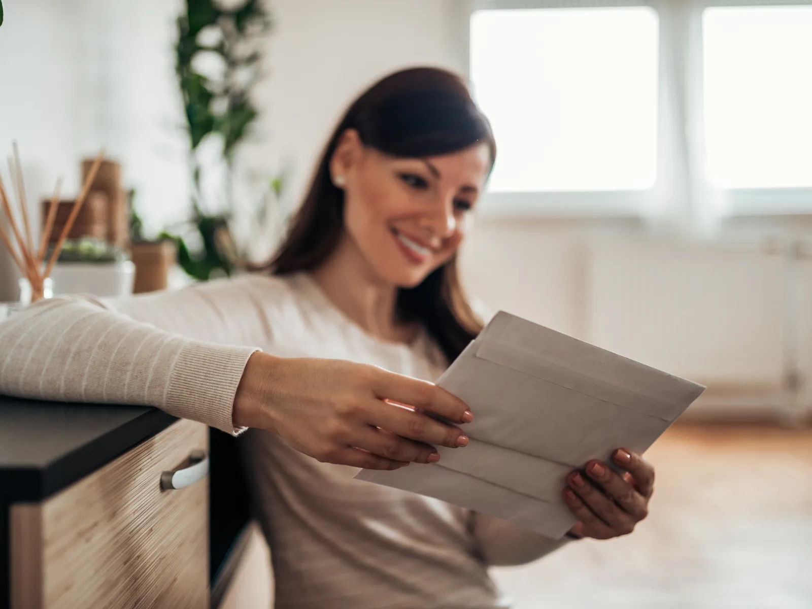 a woman holding a piece of paper