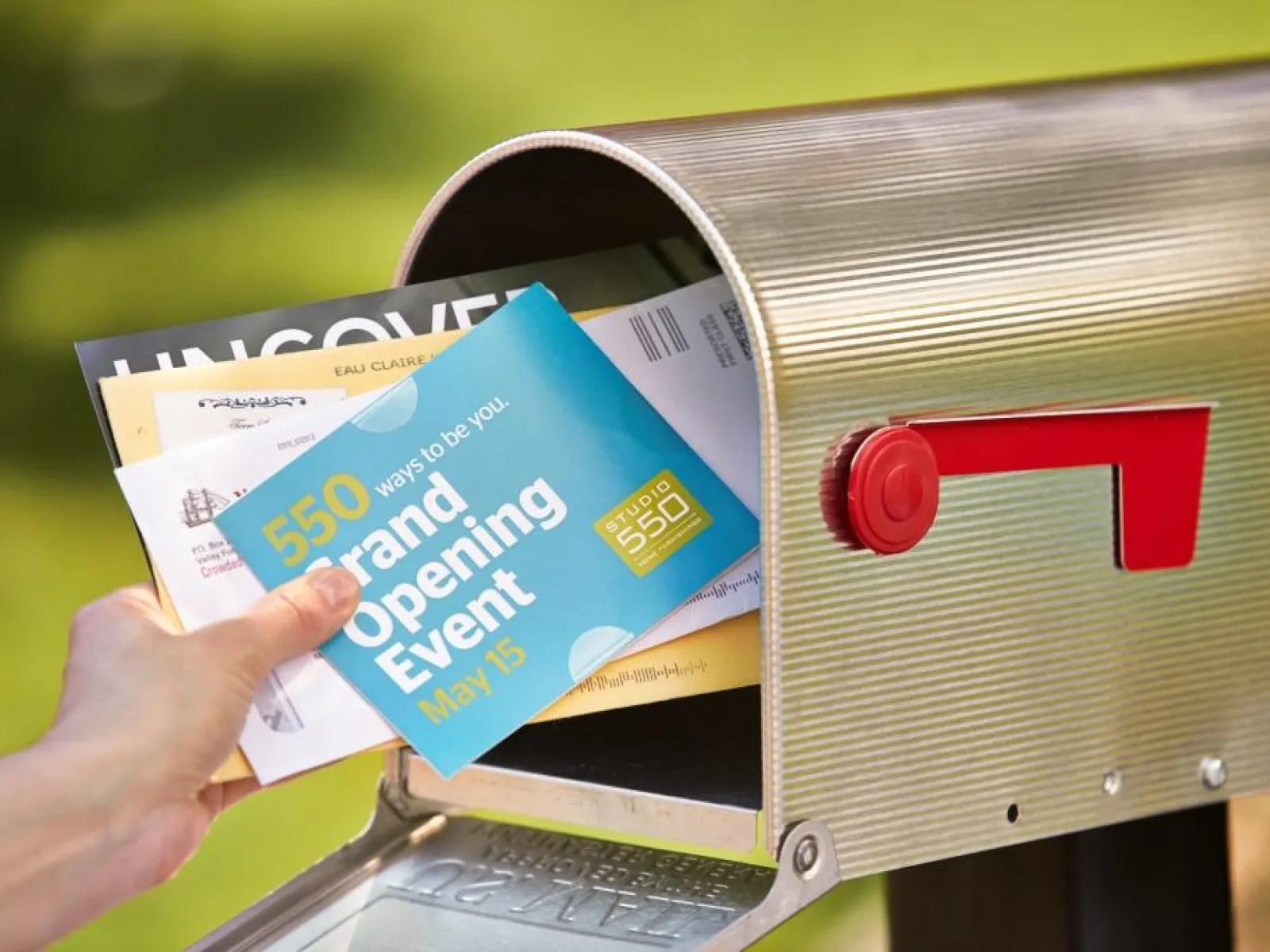 a hand holding mail