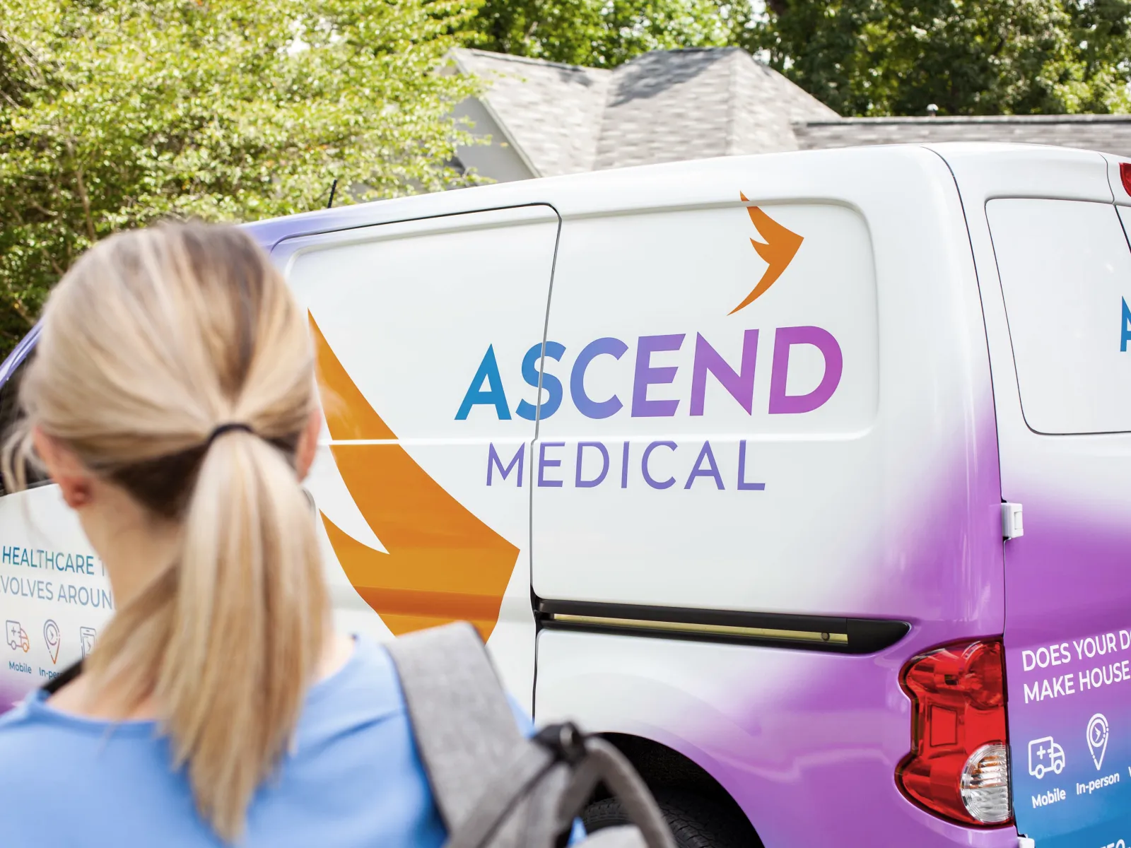 a woman standing next to a van