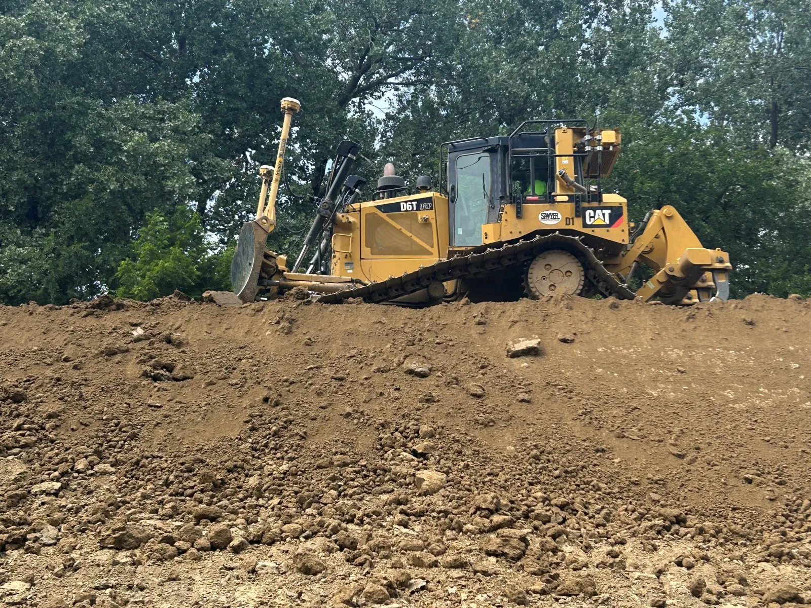 a bulldozer in a dirt field
