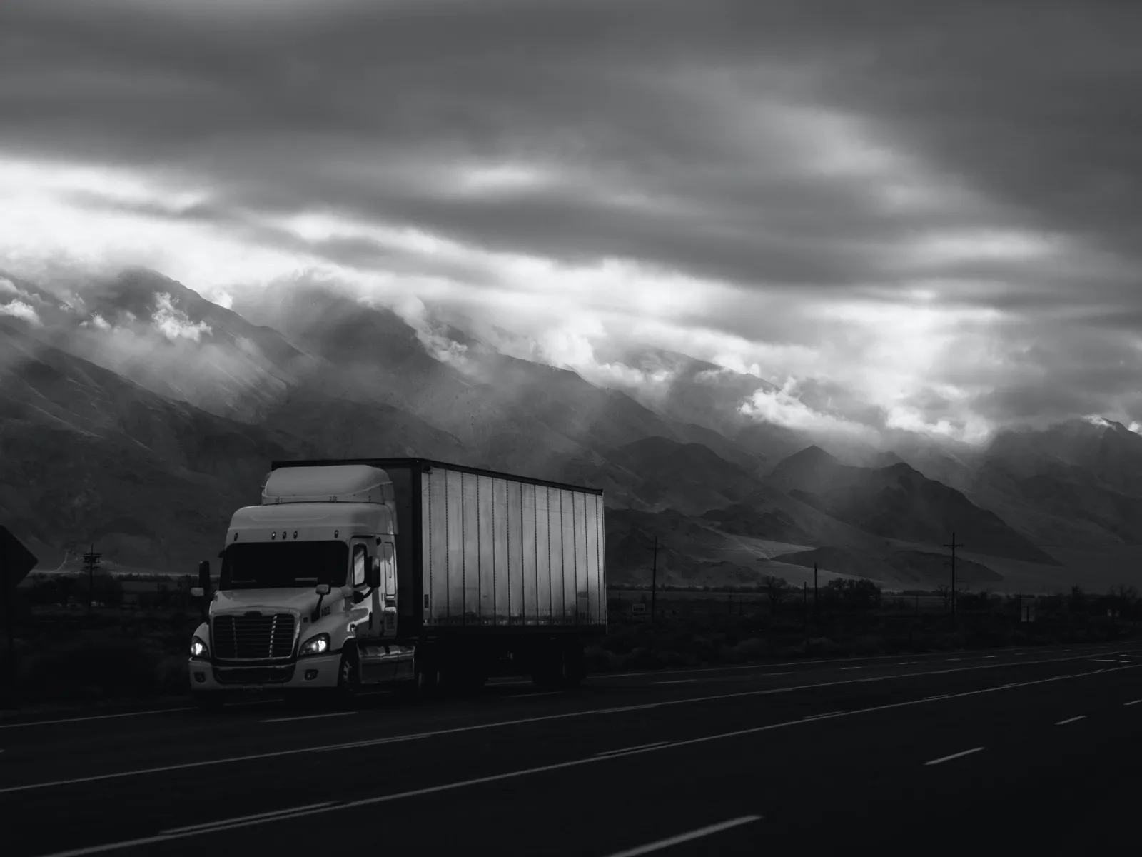 a semi truck driving down the road