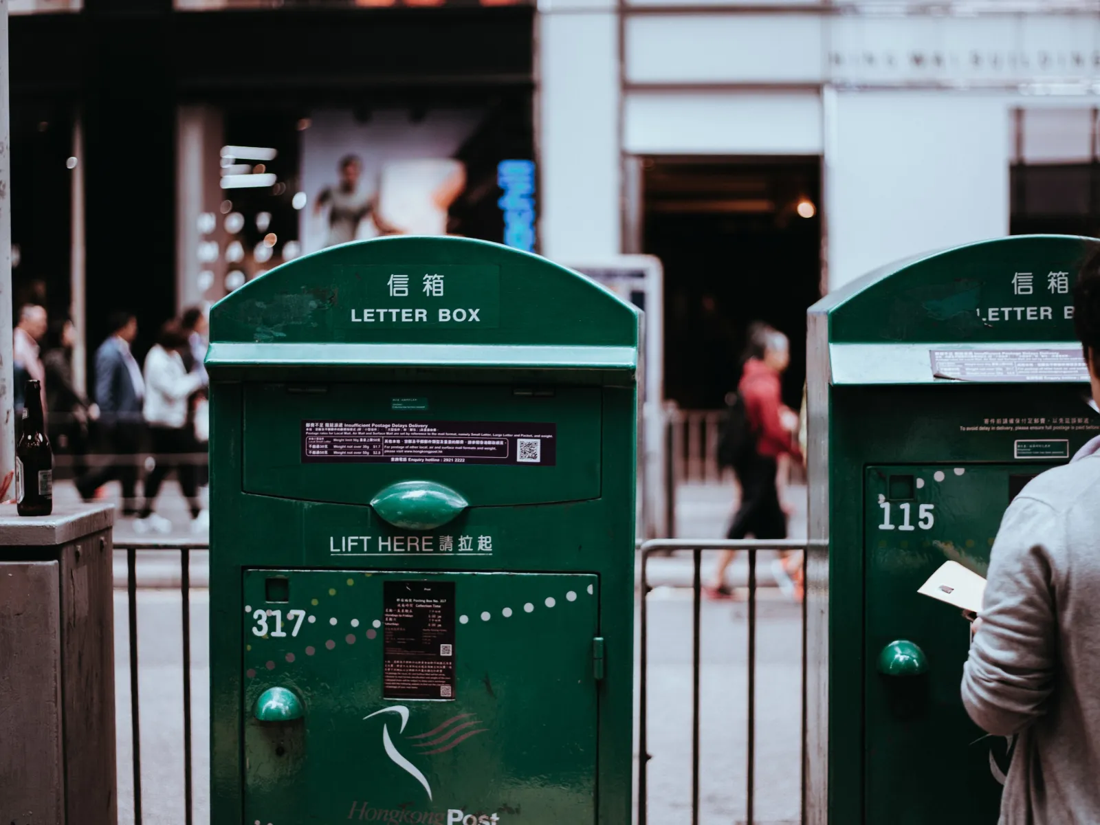 a green box with a white sign on it