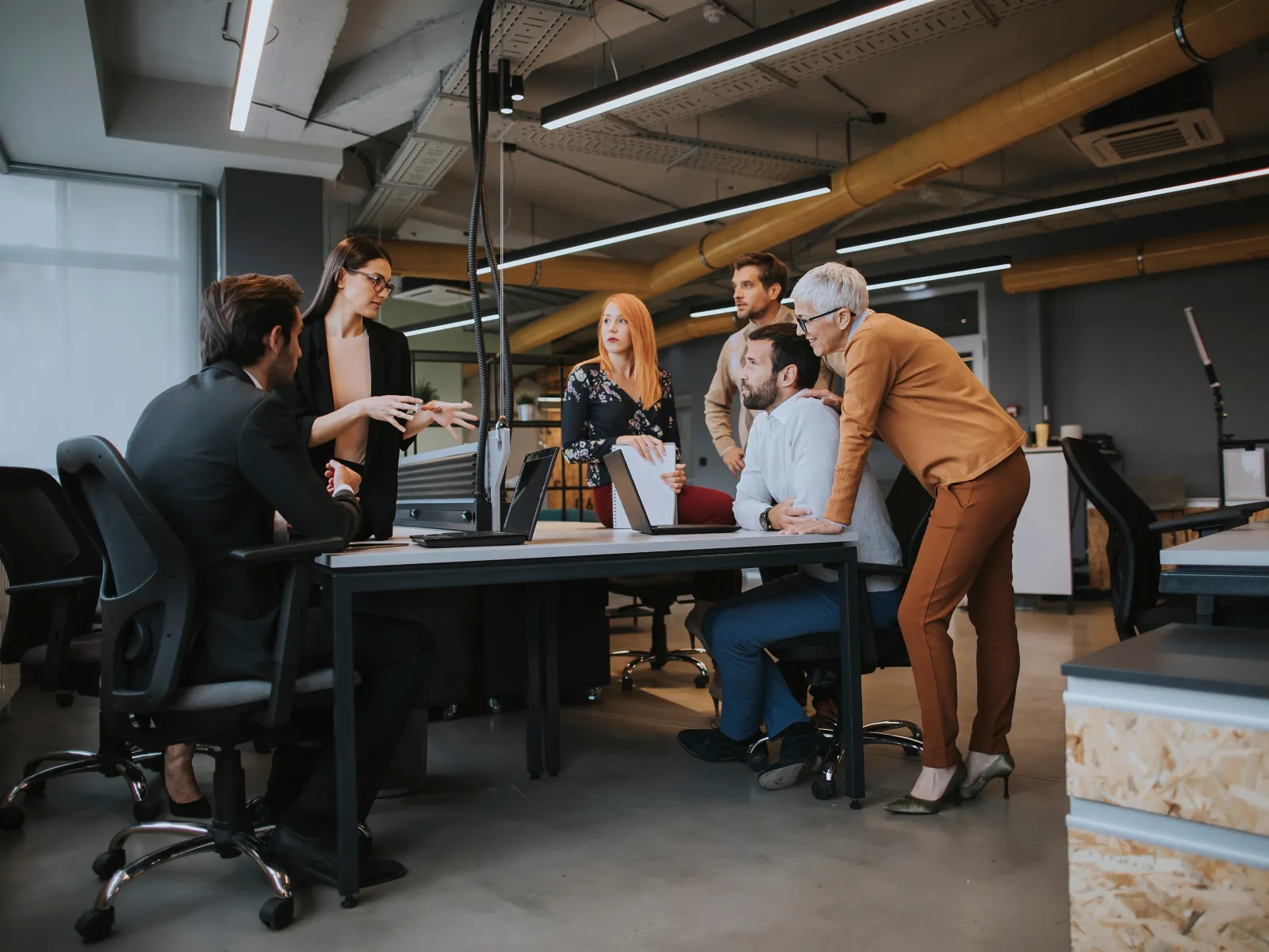 a group of people working in an office
