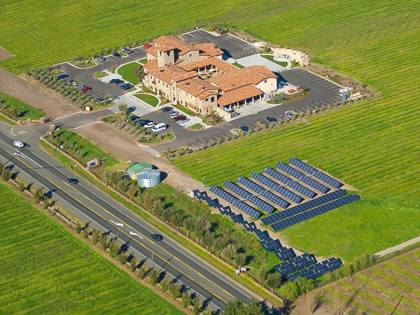 a large building with a pool in front of it