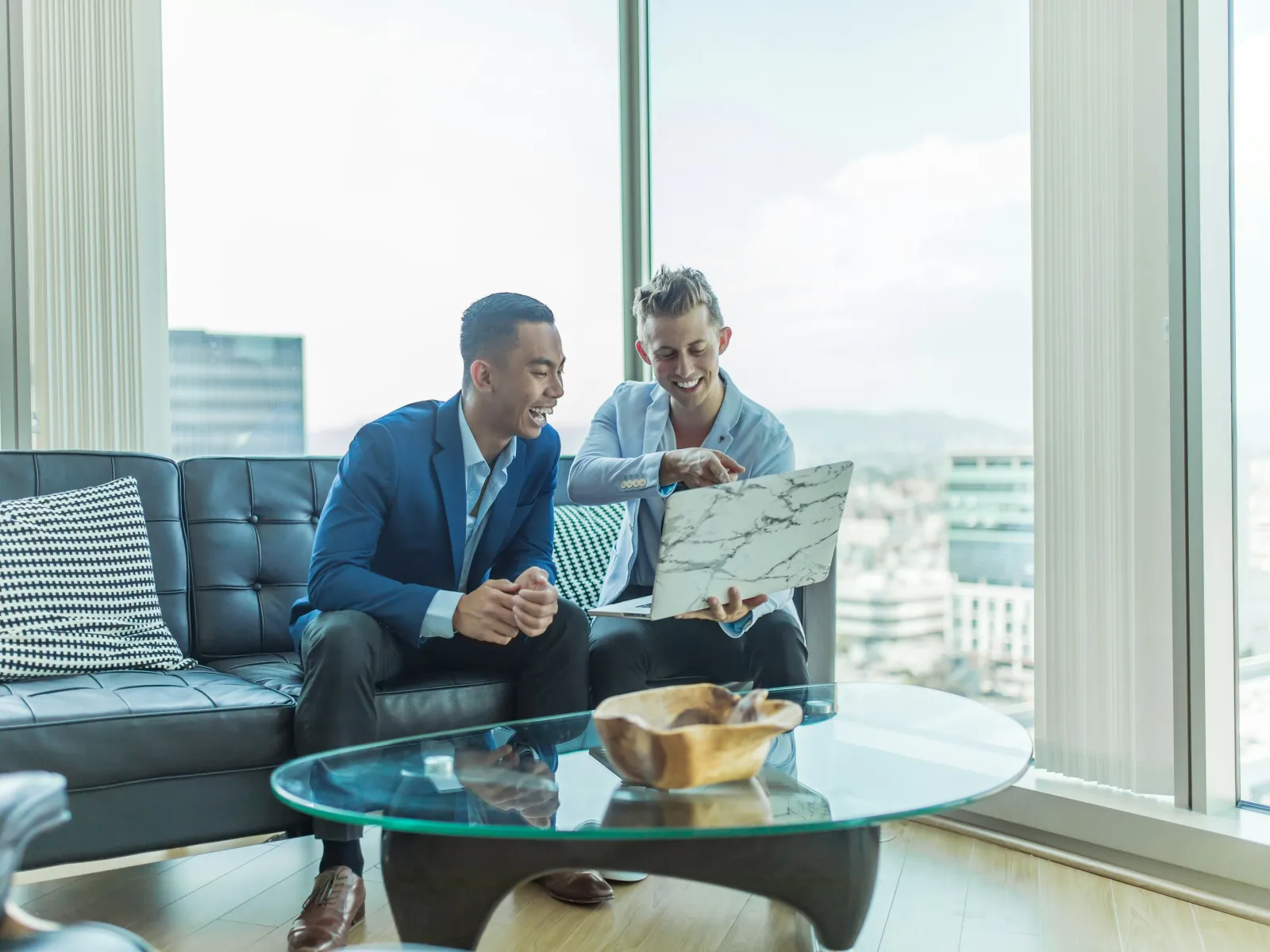men sitting on a couch
