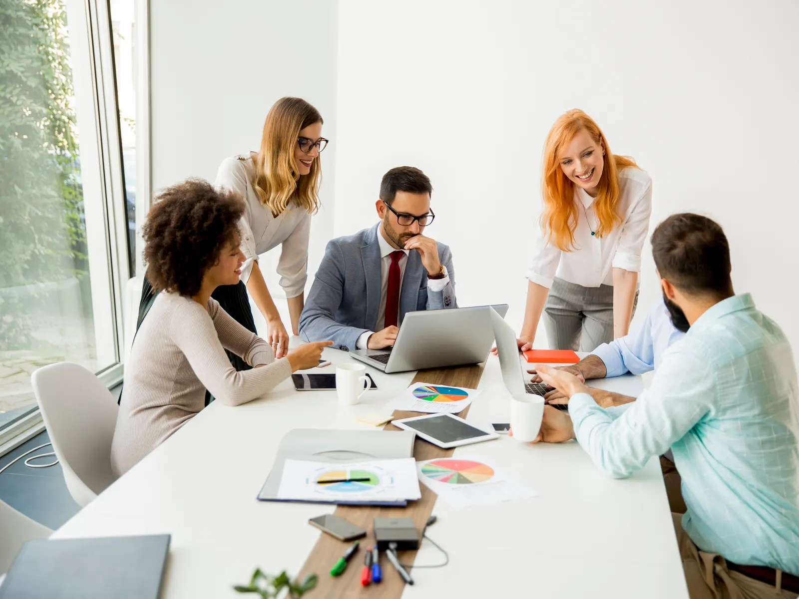 a group of people sitting around a table
