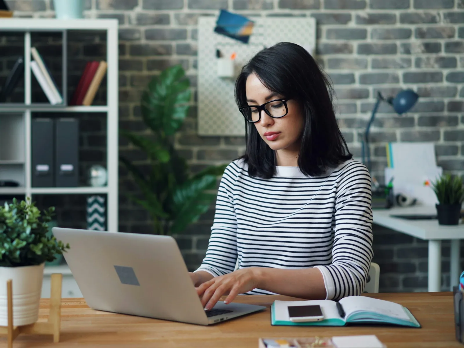 a woman working on her laptop